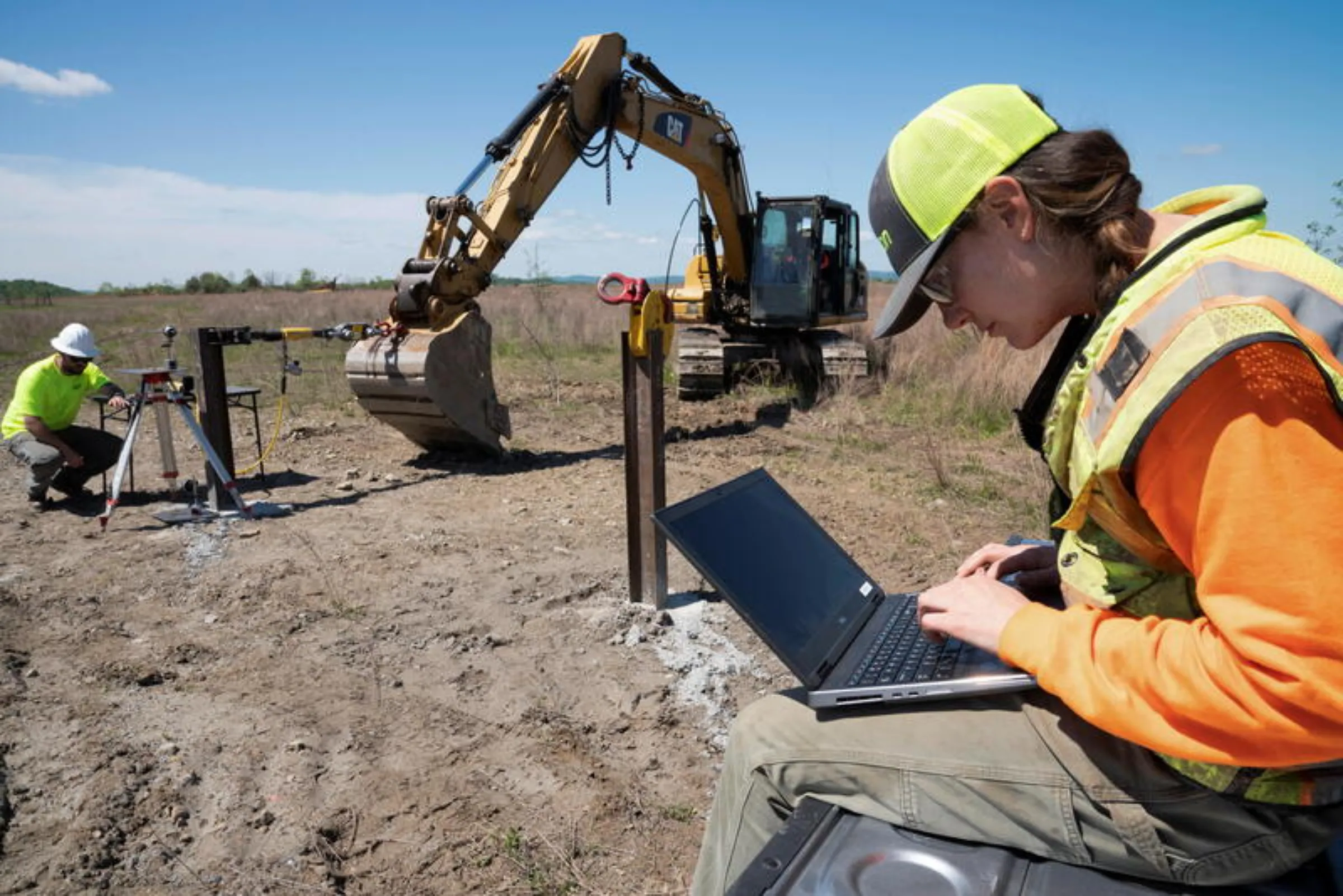 A field geologist performs ground stability testing at a solar power plant development site located on a former coal mine in Hurley, western Virginia, U.S., May 11, 2021.  REUTERS/Dane Rhys