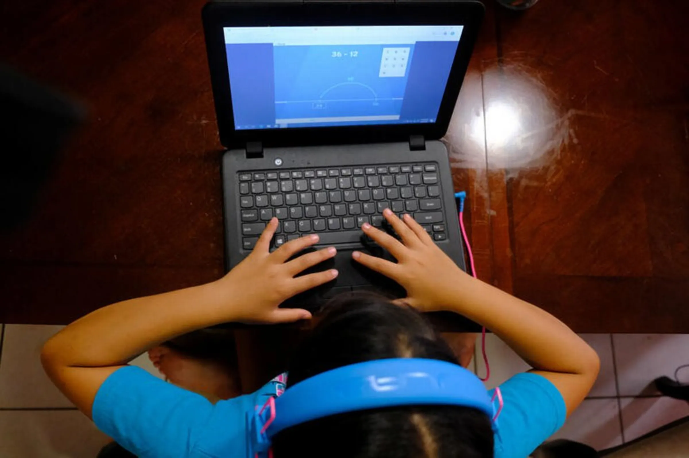 Hazeline Panditaratne completes her math assessments from her computer in Broward County, Florida, U.S. May 29, 2020.