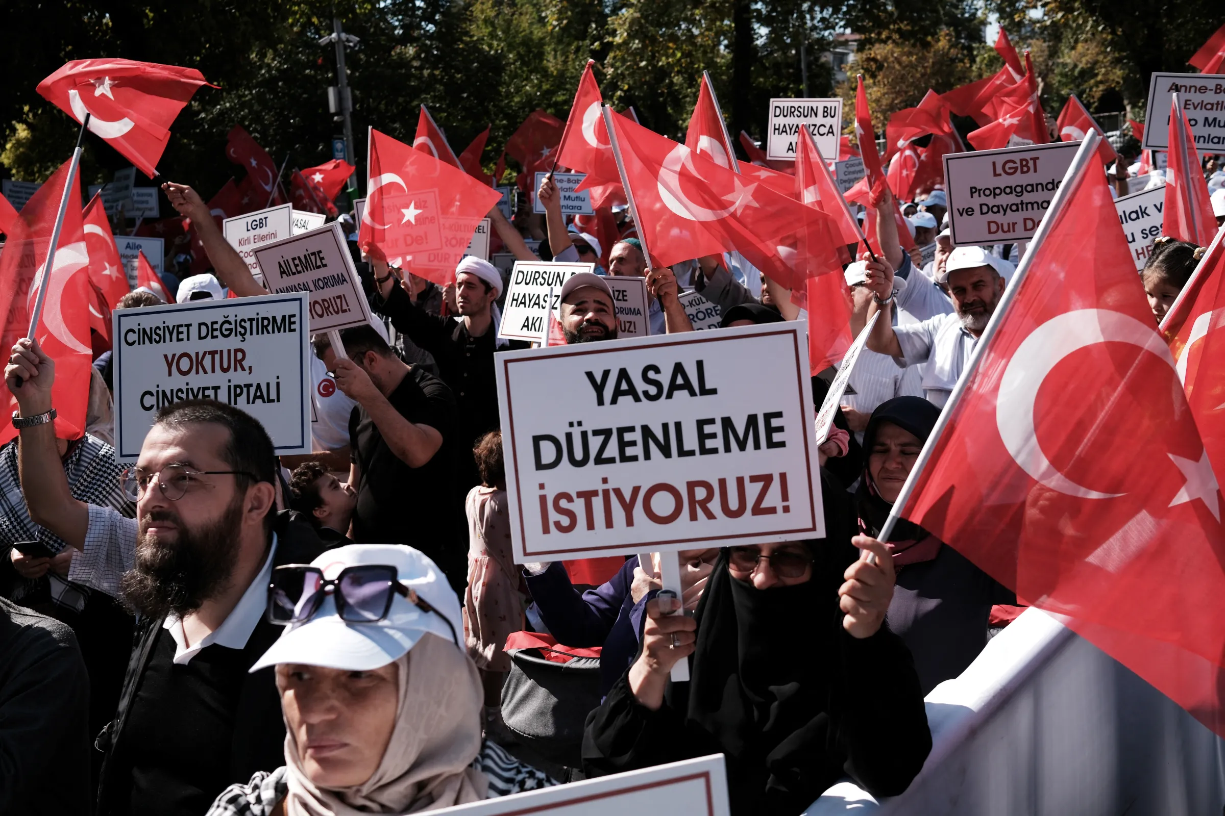 A demonstrator holds a sign reading 'We want legal regulation', as people take part in 'Big Family Gathering', an anti-LGBT rally, organised by pro-Islamic Big Family Platform in Istanbul, Turkey, September 15, 2024. REUTERS/Murad Sezer