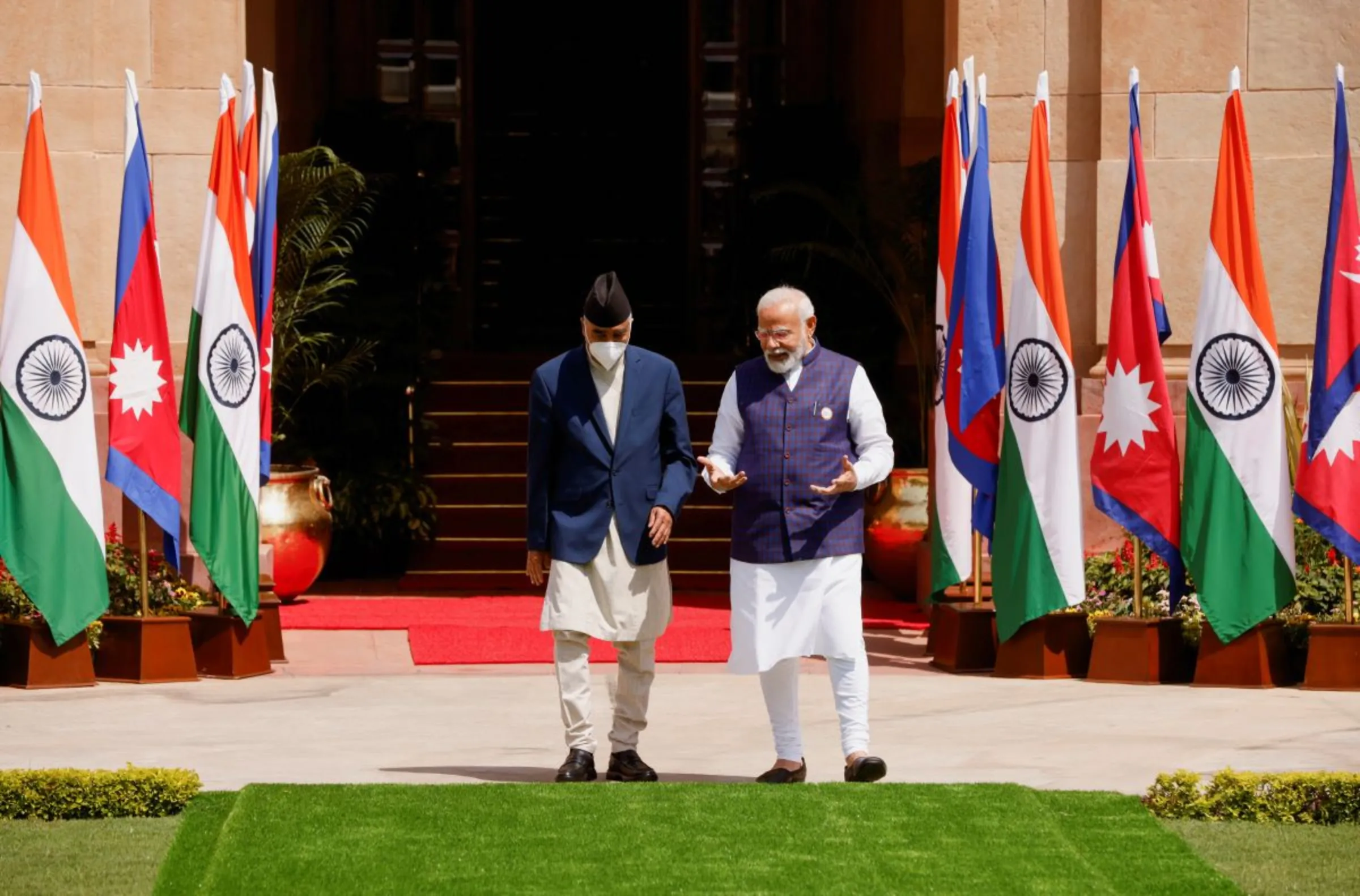 Nepal's Prime Minister Sher Bahadur Deuba speaks his Indian counterpart Narendra Modi ahead of their meeting at Hyderabad House in New Delhi, India April 2, 2022