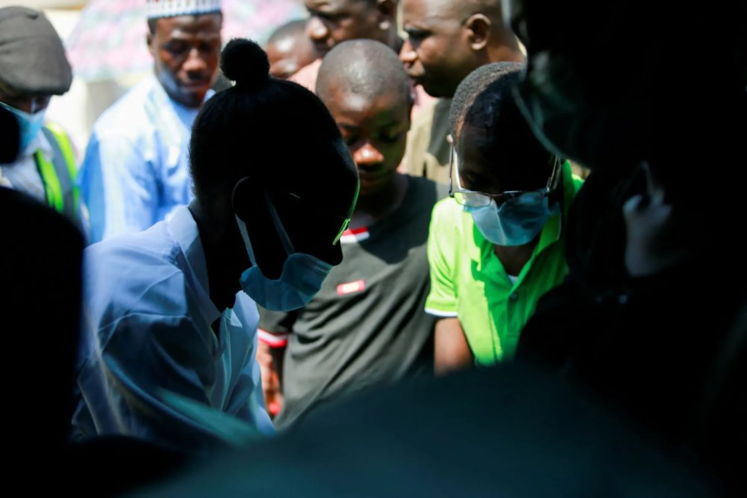 Health workers are seen working during a mass vaccination exercise, at Wuse market in Abuja, Nigeria January 26, 2022