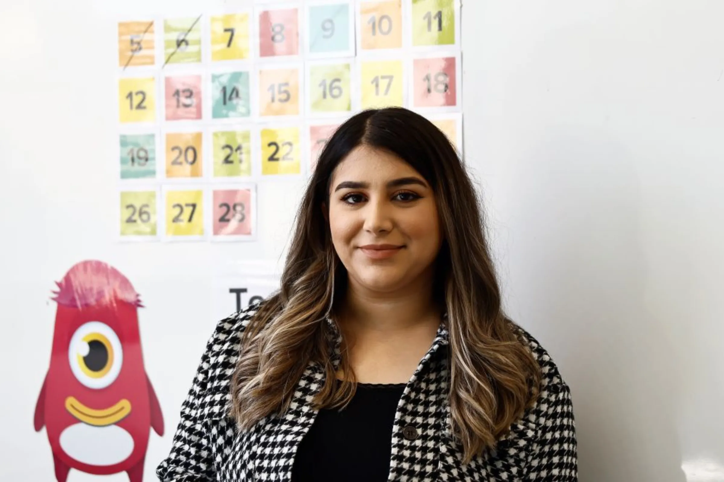 Shana Shamal Mahmoud poses for a photograph outside her class, Baghdad, Iraq, February 27, 2023