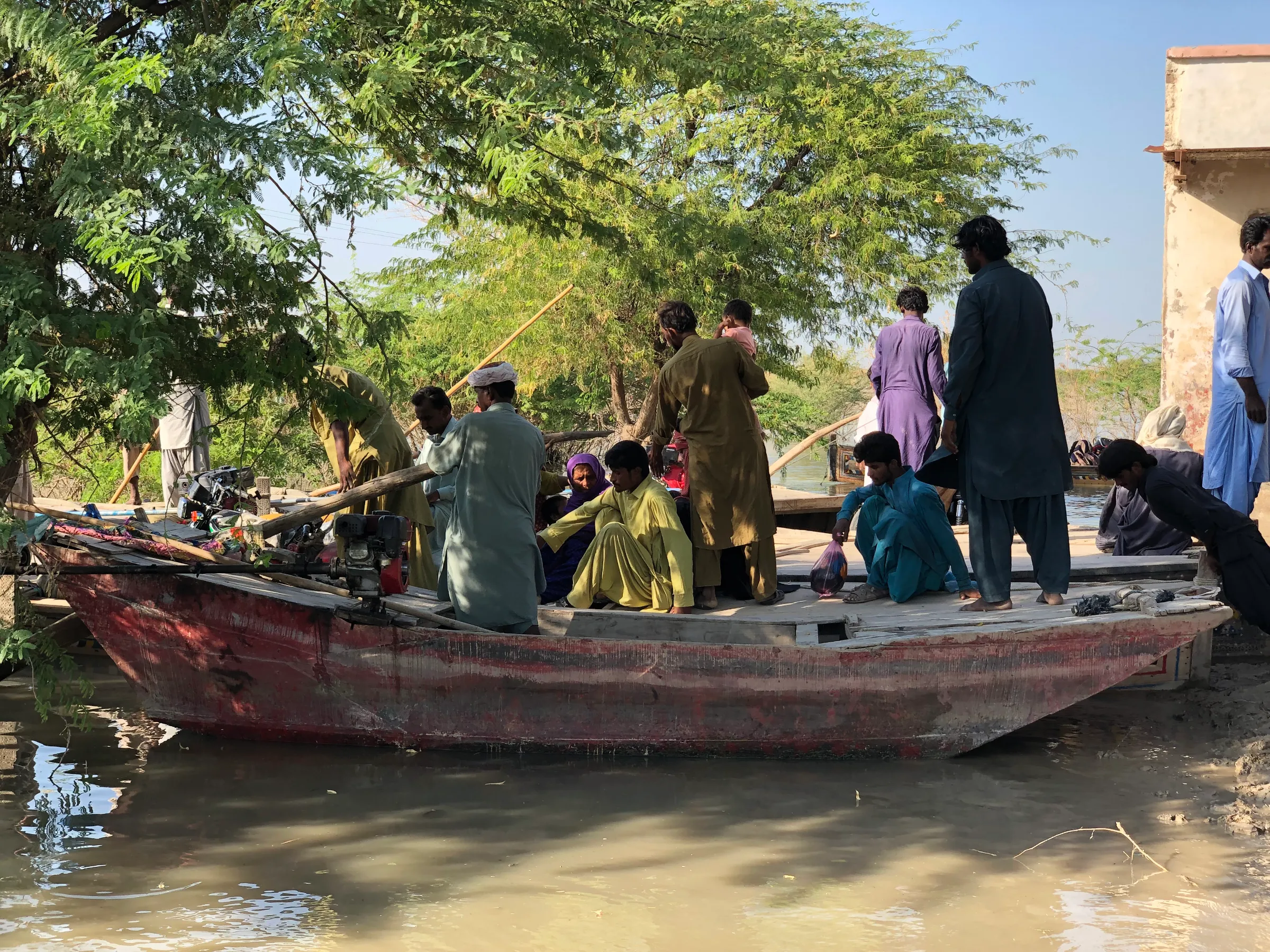 The main road at Chandhan Mori, a marketplace that often gets inundated during flooding and has developed big potholes, making navigation difficult, in Sindh province, Pakistan, October 14, 2022. Thomson Reuters Foundation/Zofeen Ebrahim