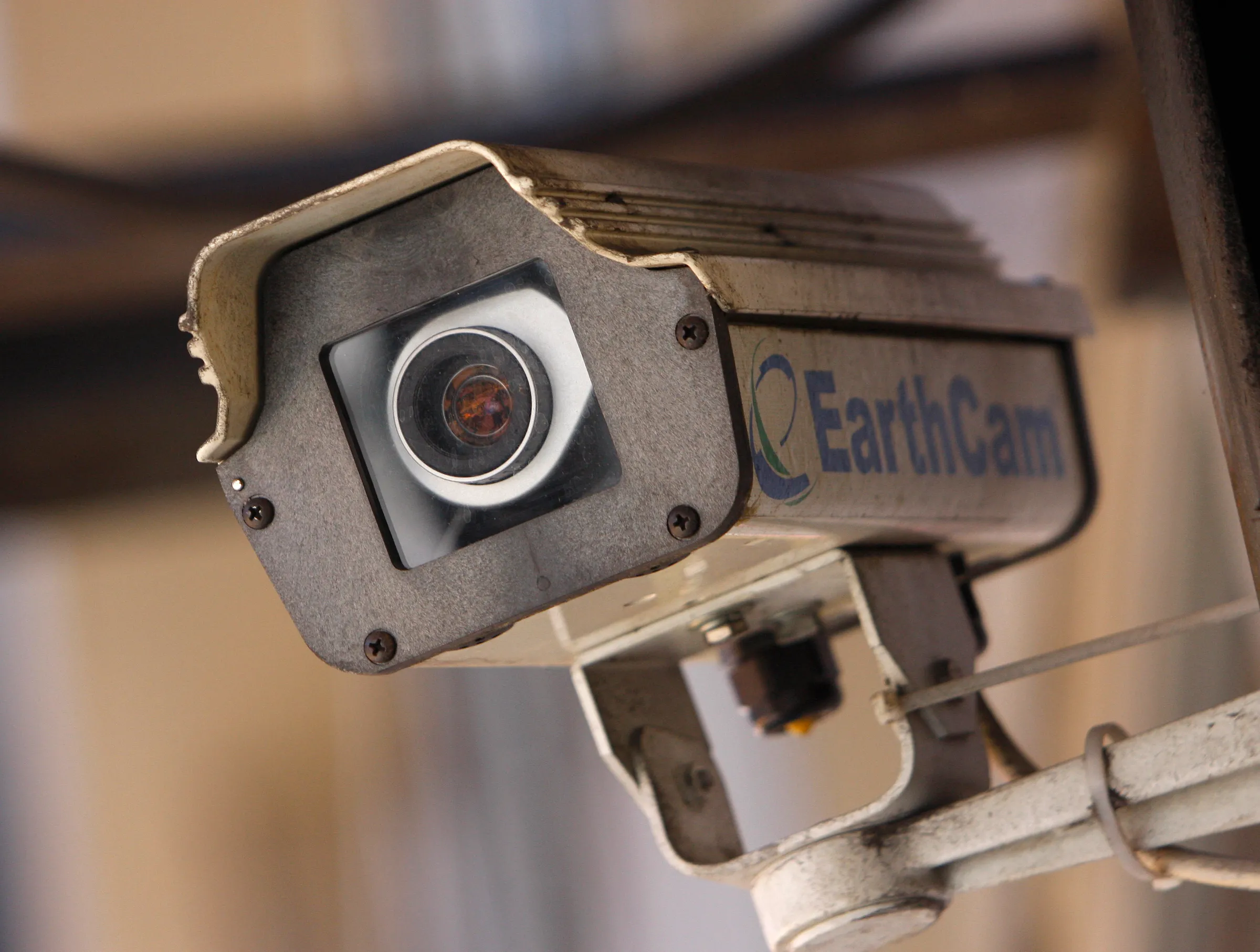 A security camera sits on a building in New York City March 6, 2008. The New York City Police Department are using evidence from video tapes from nearby buildings to catch a suspect involved in a bombing at the Armed Forces Career Center. REUTERS/Joshua