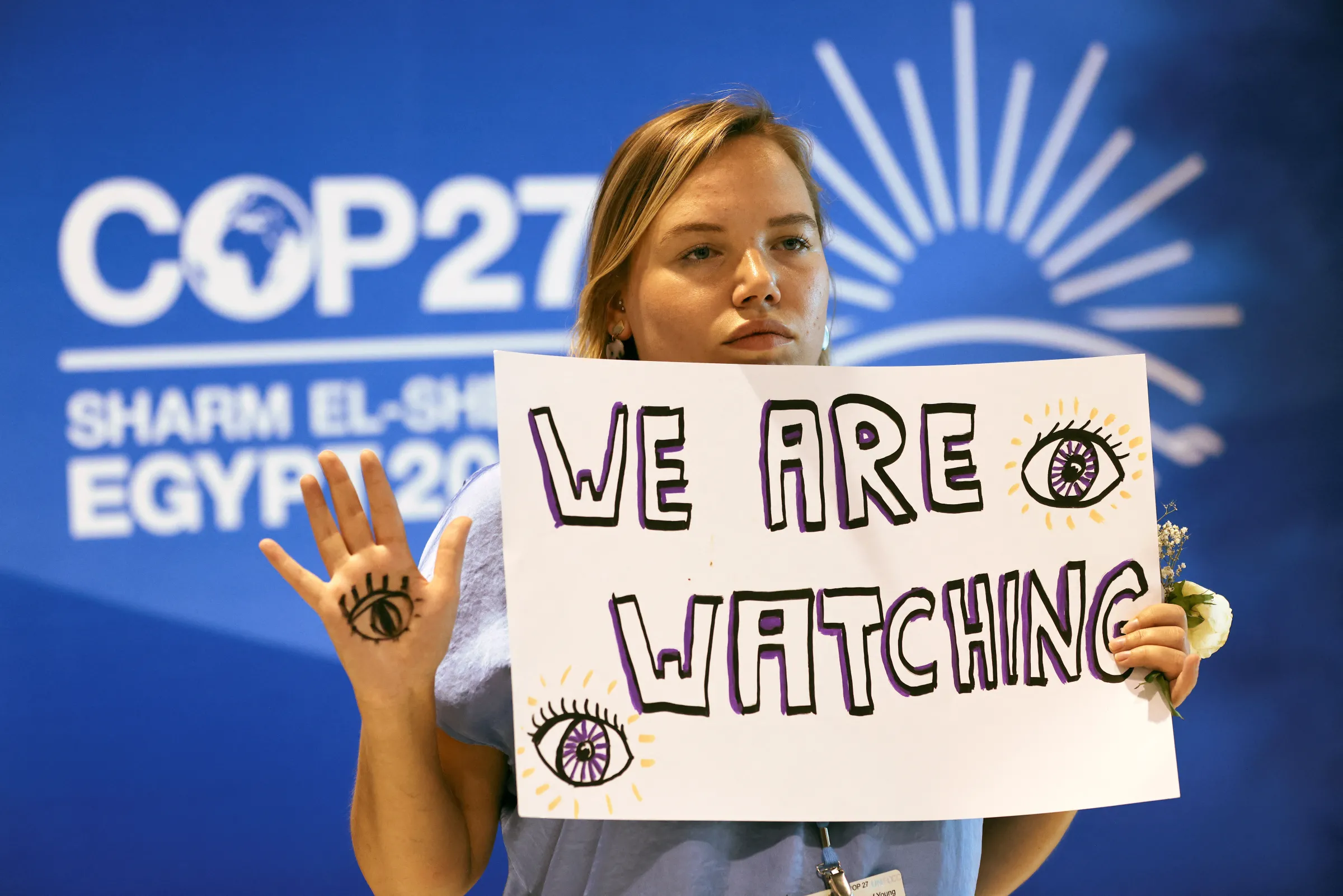 A climate activist takes part in a protest, during the COP27 climate summit, in Sharm el-Sheikh, Egypt, November 19, 2022. REUTERS/Mohamed Abd El Ghany