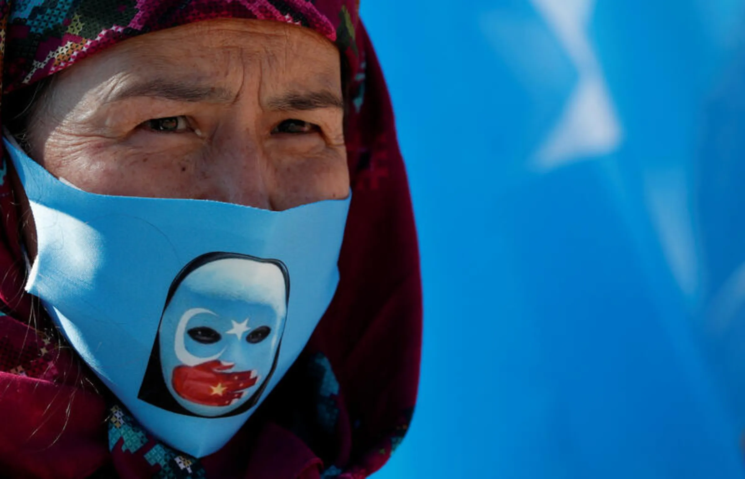 An Ethnic Uighur demonstrator wearing a protective face mask takes part in a protest against China, in Istanbul, Turkey October 1, 2020. REUTERS/Murad Sezer