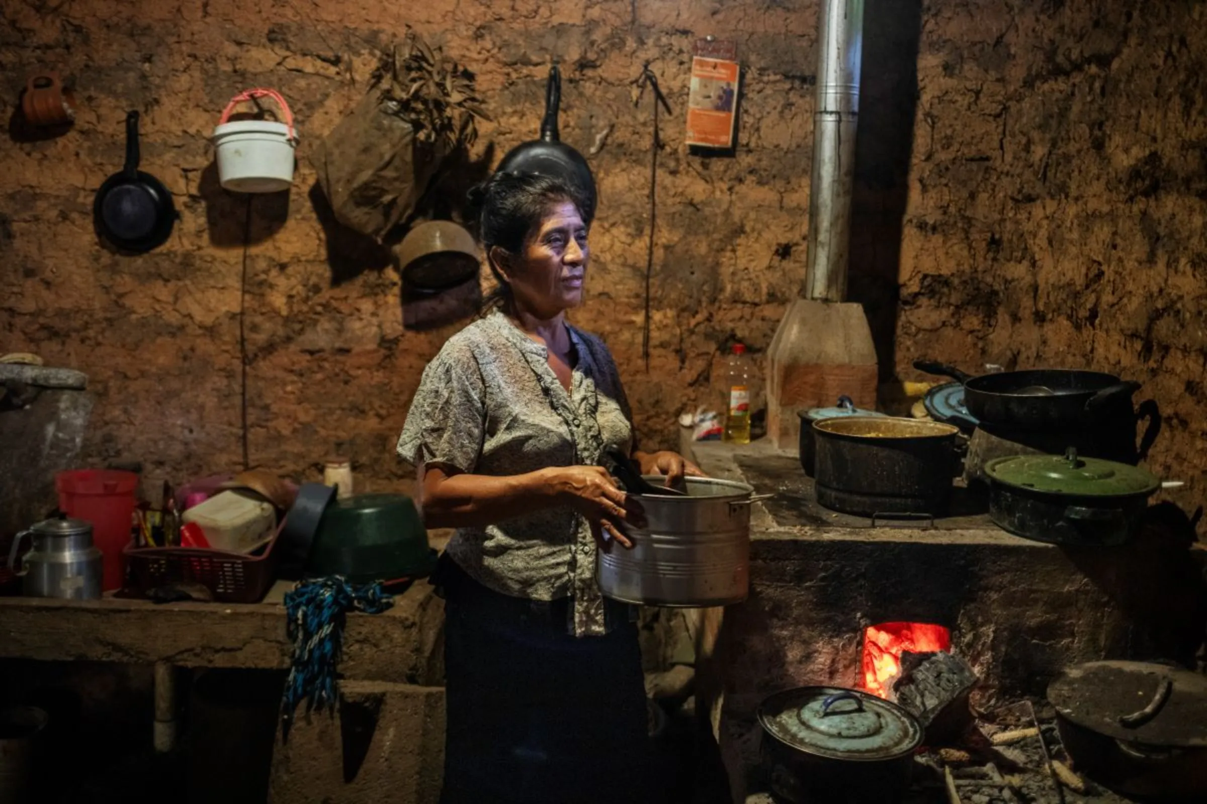 Lorenza Mendoza, whose son migrated to the United States earlier this year, in the kitchen at her farm in the eastern province of Chiquimula, Guatemala, September 7, 2023. Thomson Reuters Foundation/Fabio Cuttica