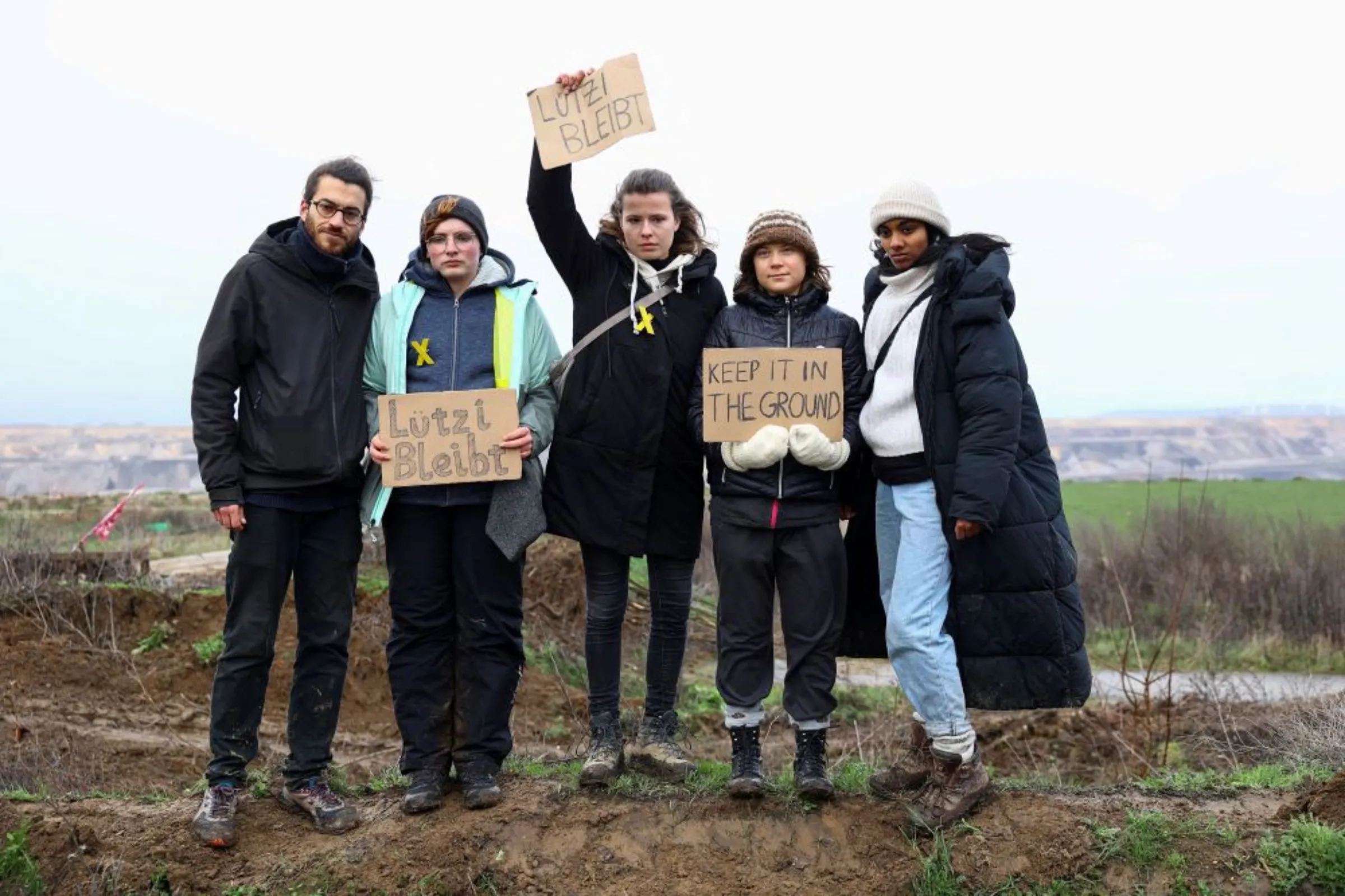 Climate activists Luisa Neubauer, Greta Thunberg, Lakshmi Thevasagayam, and Florian Oezcan protest against the expansion of the Garzweiler open-cast lignite mine of Germany's utility RWE, in Luetzerath, Germany, January 13, 2023. REUTERS/Christian Mang