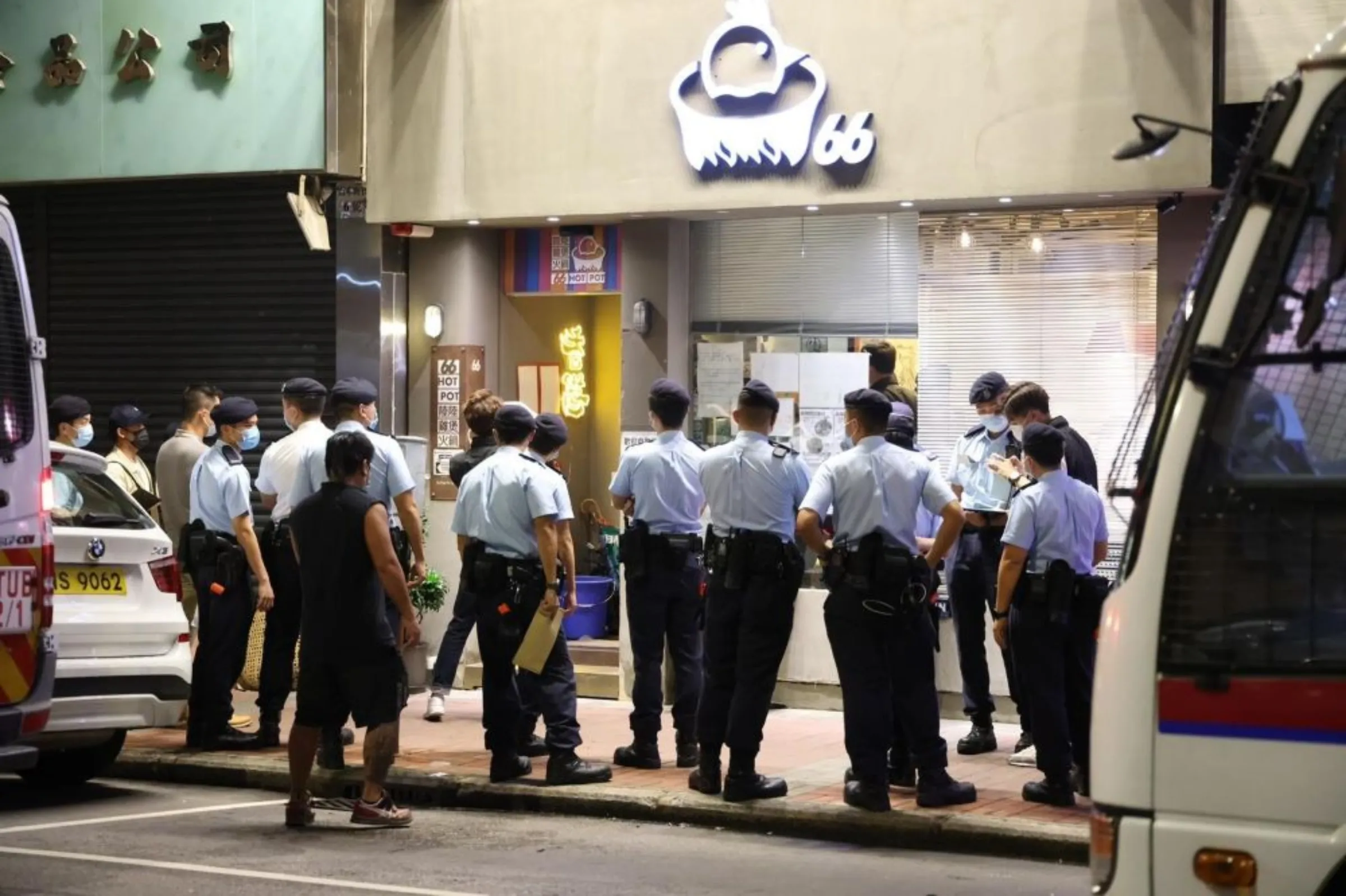 Sam Wong's restaurant in Hong Kong is surrounded by police during the arrest of his business partner. Handout via Thomson Reuters Foundation