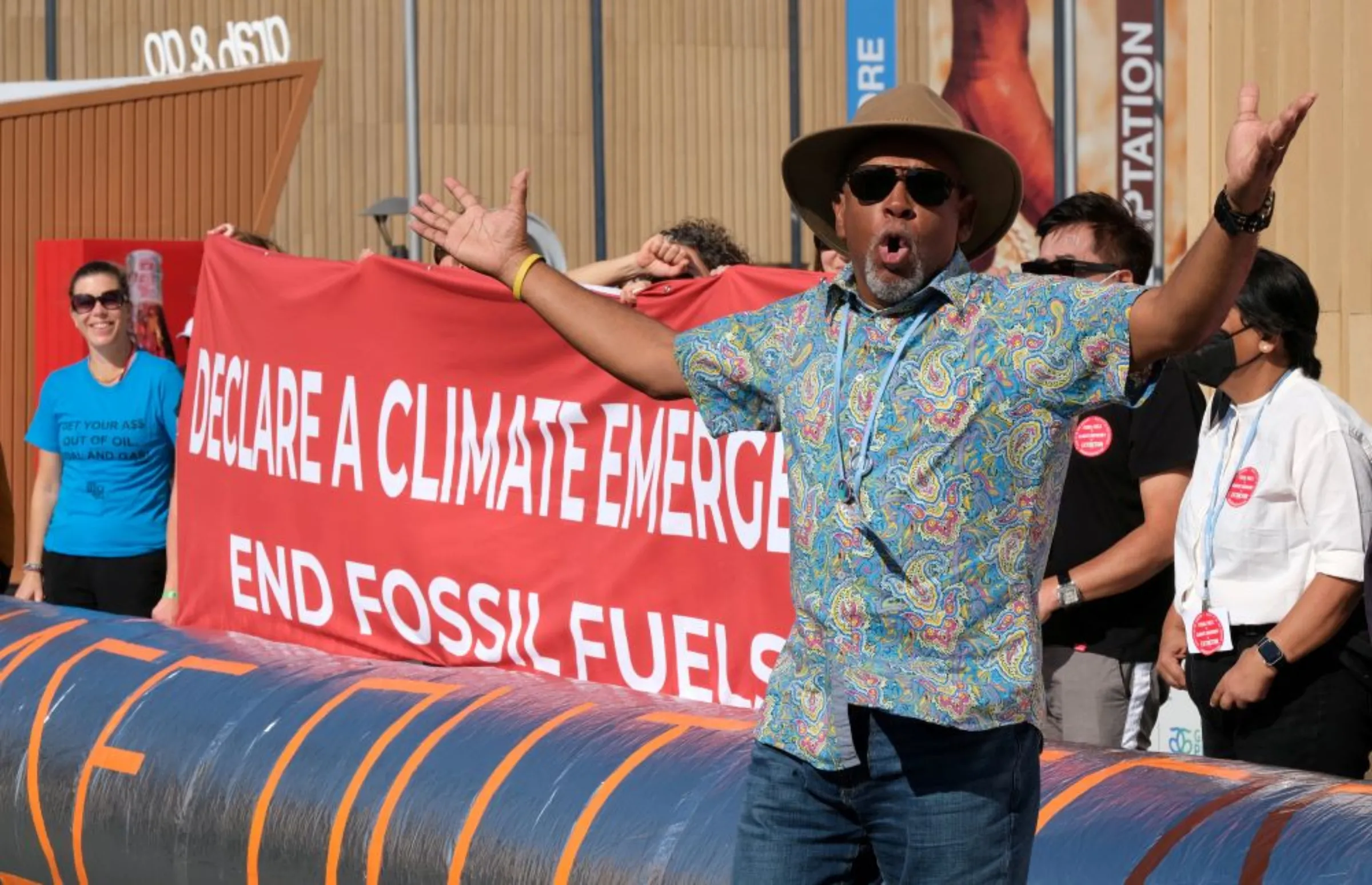 Activists hold a rapid response demonstration to implore countries to phase out all fossil fuels, at the COP27 climate summit in the Red Sea resort of Sharm el-Sheikh, Egypt, November 18, 2022. REUTERS/Emilie Madi