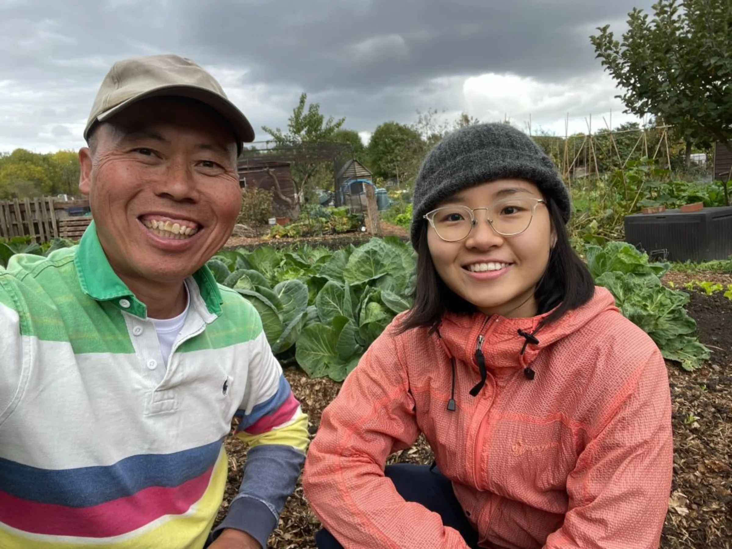 Yu-wing Wong and Perle Wong, founders of AuLaw Organic Farm UK, are seen in a selfie taken at their allotment in New Malden, south London in October 2022. Thomson Reuters Foundation