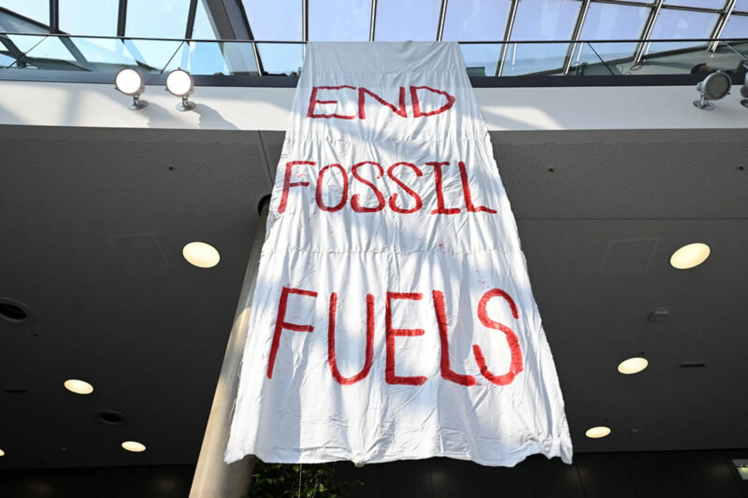 A banner reads 'End Fossil Fuels' at the Bonn Climate Change Conference in Germany, June 8, 2023. REUTERS/Jana Rodenbusch