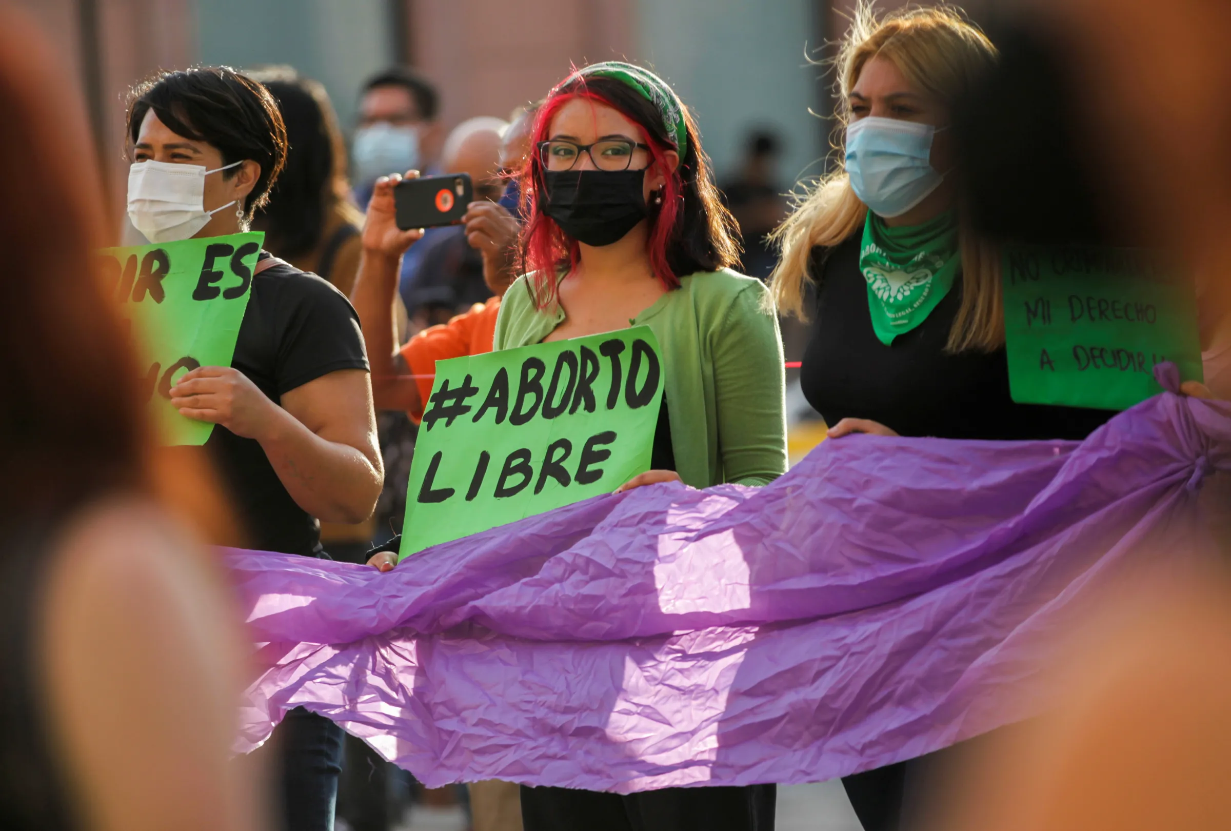 A woman holds a banner which reads 'Free abort' during a protest to celebrate the decision of the Supreme Court of Justice of the Nation (SCJN) that declared the criminalization of abortion as unconstitutional