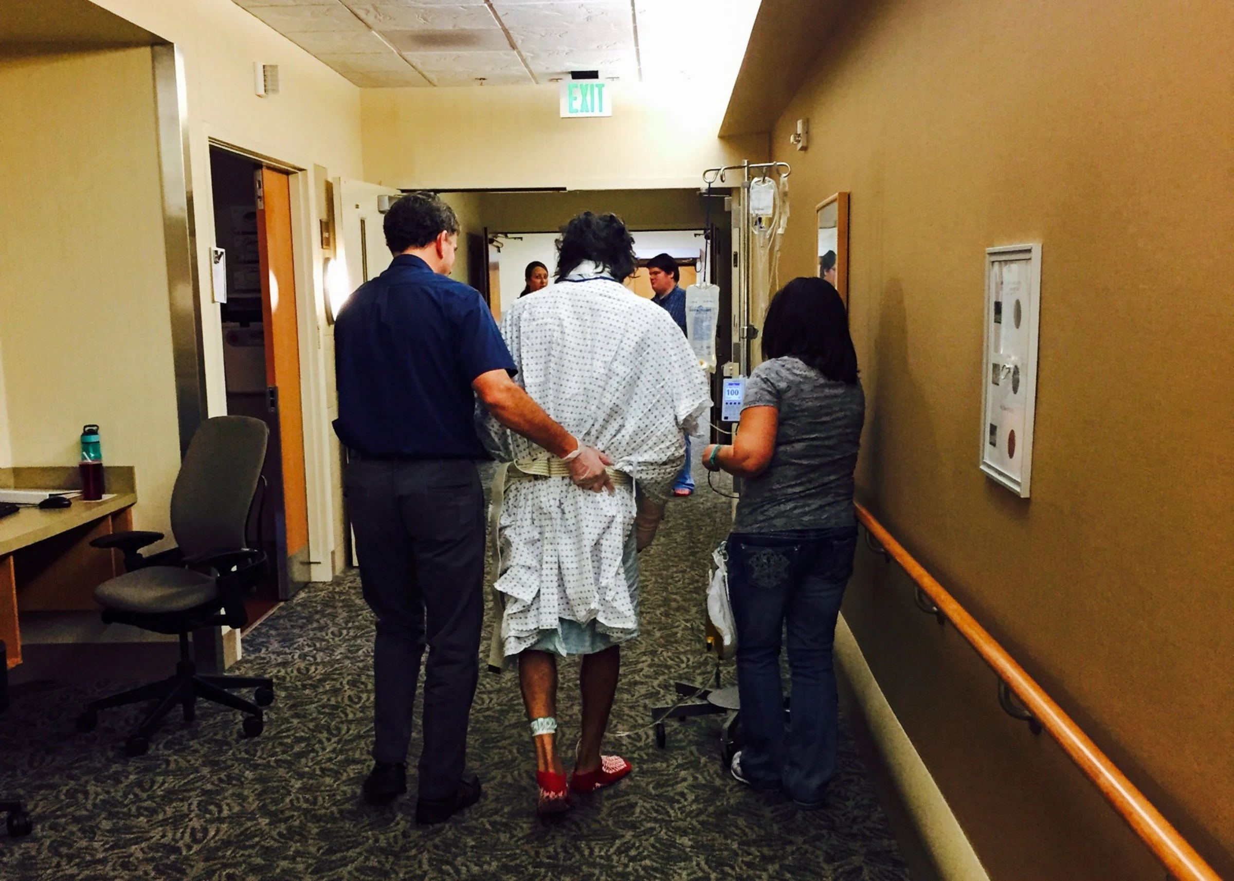 Richard 'Wally' Ochoa walks down a hospital corridor after being hit by a falling tree while defending a small Idaho community from a wildfire, in this undated photo