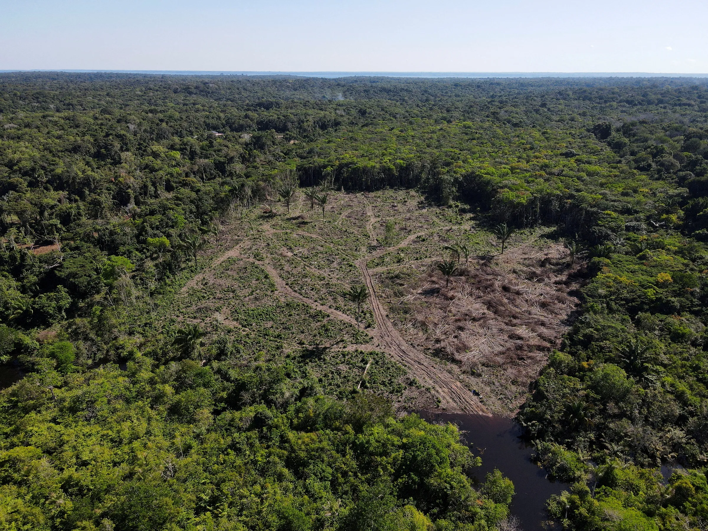 An aerial view shows a deforested plot of the Amazon rainforest in Manaus, Amazonas State, Brazil July 8, 2022. REUTERS/Bruno Kelly