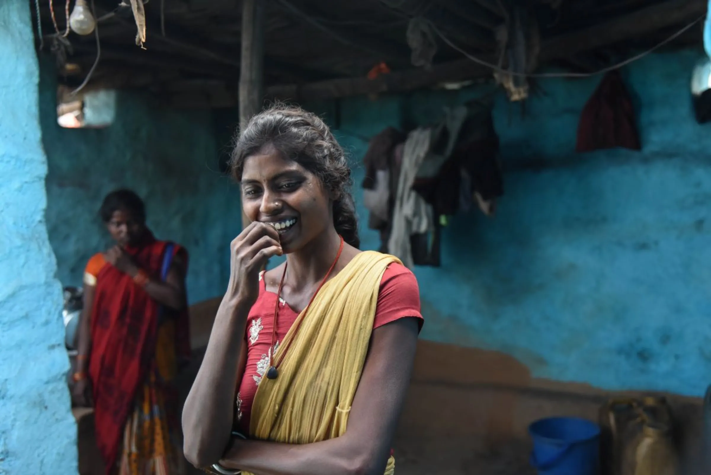 College student Aarti Paswan gestures while standing at a neighbour's house in Jharia coalfield, India, on November 10, 2022. Thomson Reuters Foundation/Tanmoy Bhaduri