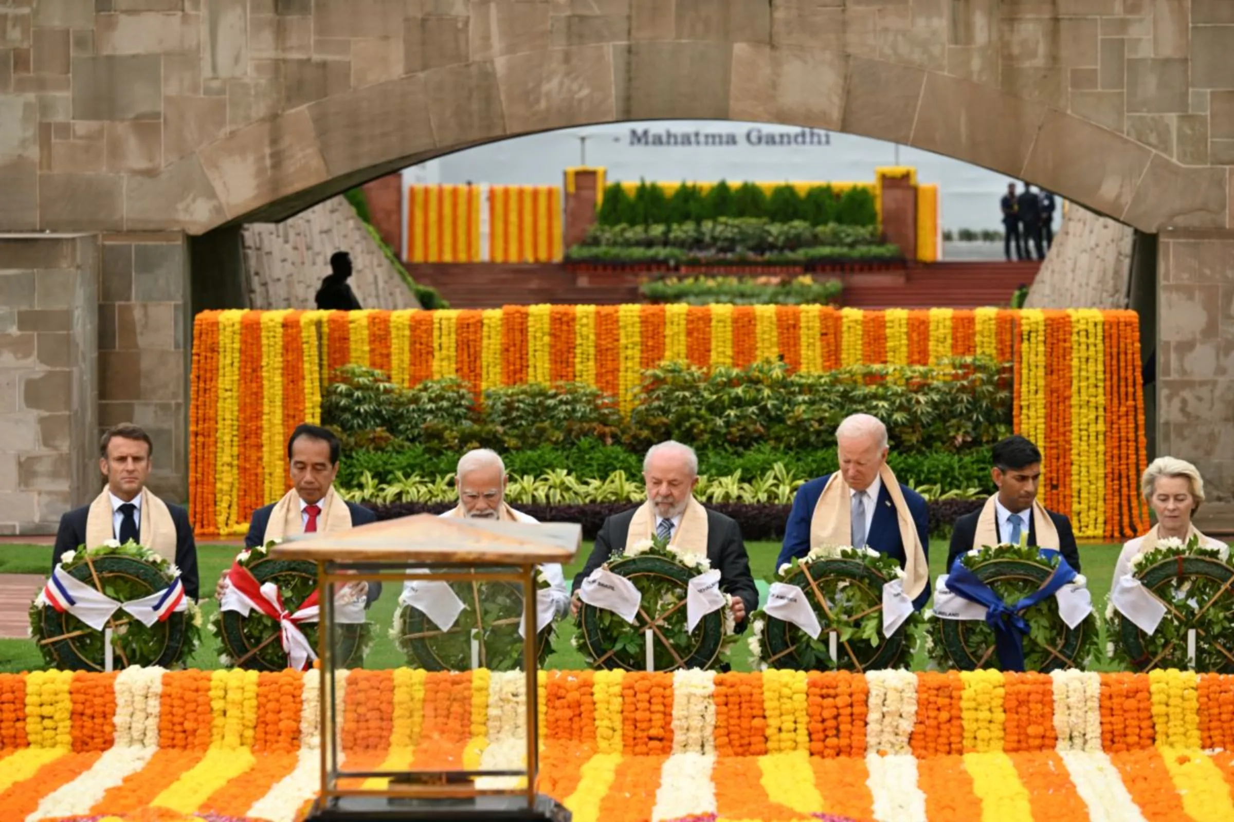 French President Emmanuel Macron, Indonesia President Joko Widodo, India Prime Minister Narendra Modi, Brazil President Luiz Inacio Lula da Silva, U.S. President Joe Biden, UK Prime Minister Rishi Sunak and European Commission President Ursula von der Leyen visit Raj Ghat memorial with other G20 leaders, Sept. 10, 2023, in New Delhi