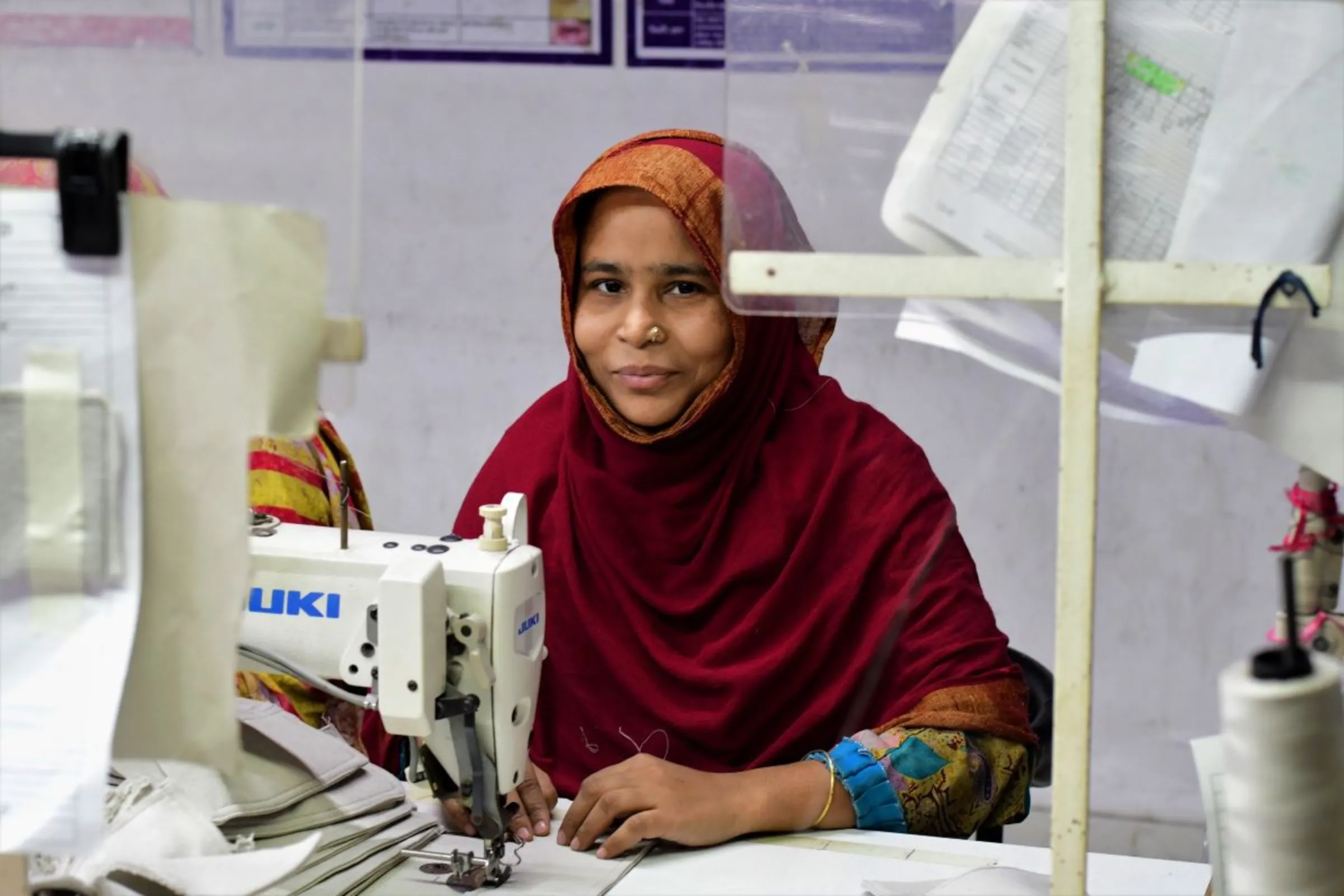 Garment worker Shima Akter works at the Plummy Fashions factory at North Narayanganj, Bangladesh, January 31, 2023. Thomson Reuters Foundation/Mosabber Hossain