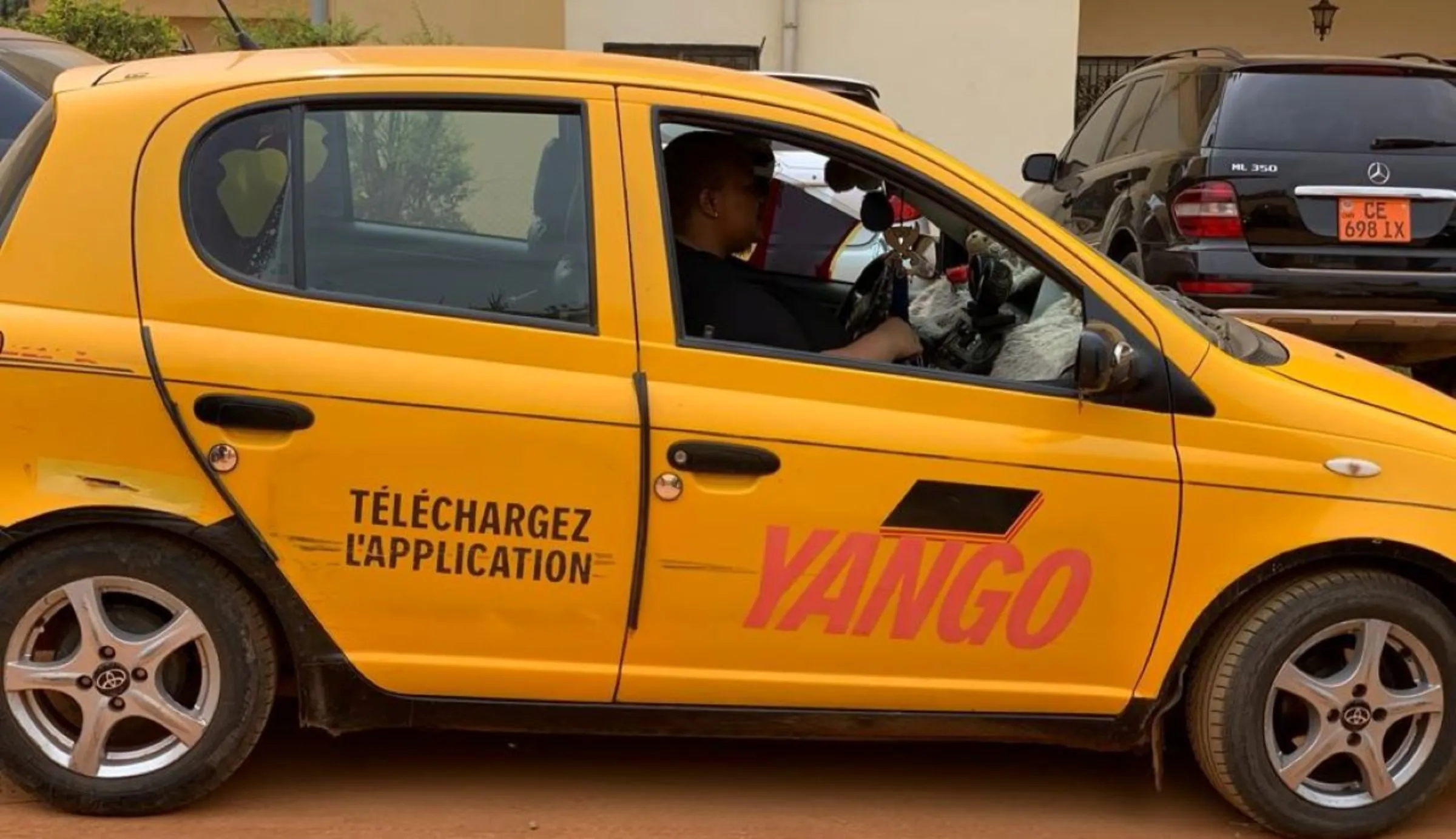 A Yango ride-hailing taxi in Yaounde, Cameroon. January 22, 2023. Thomson Reuters Foundation/Maikem Emmanuela