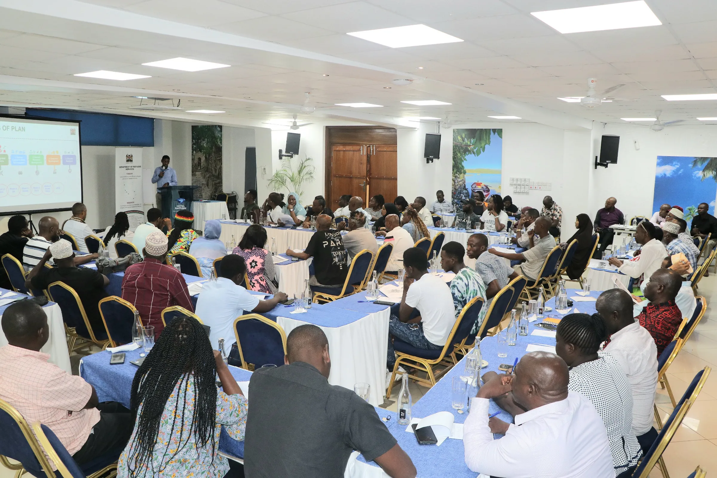 People from refugee groups and other interested parties attend a public consultation forum on the Shirika Plan in Mombasa, Kenya. Feb. 24, 2025.  Department of Refugee Services (Kenya)/Handout via Thomson Reuters Foundation
