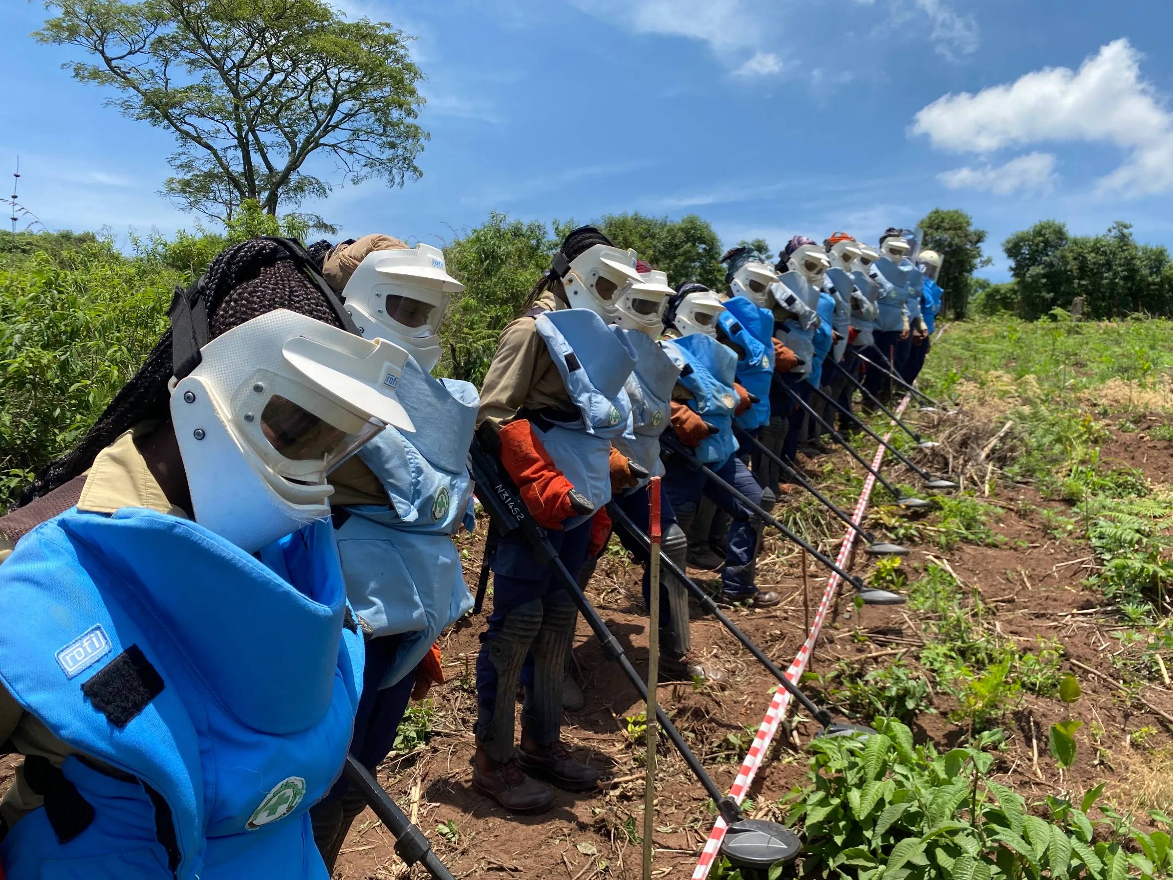 Female deminers in a minefield in Chipinge, Zimbabwe. December 5, 2022. Thomson Reuters Foundation/Farai Shawn Matiashe