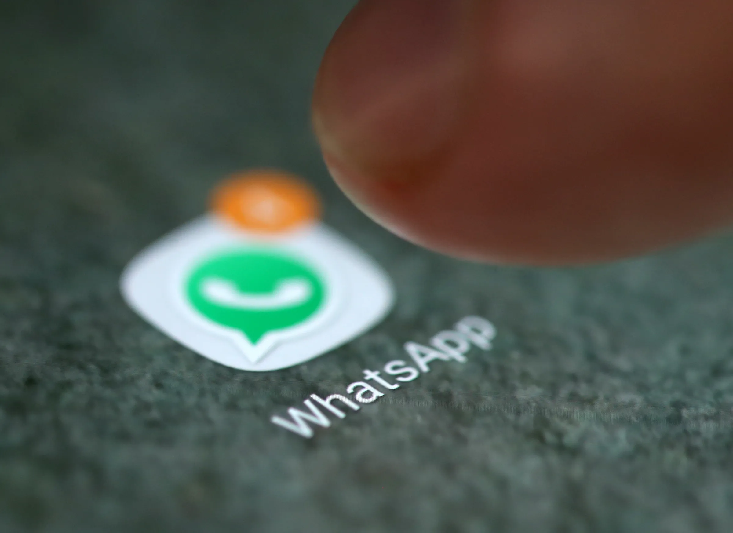 The WhatsApp app logo is seen on a smartphone in this picture illustration taken September 15, 2017