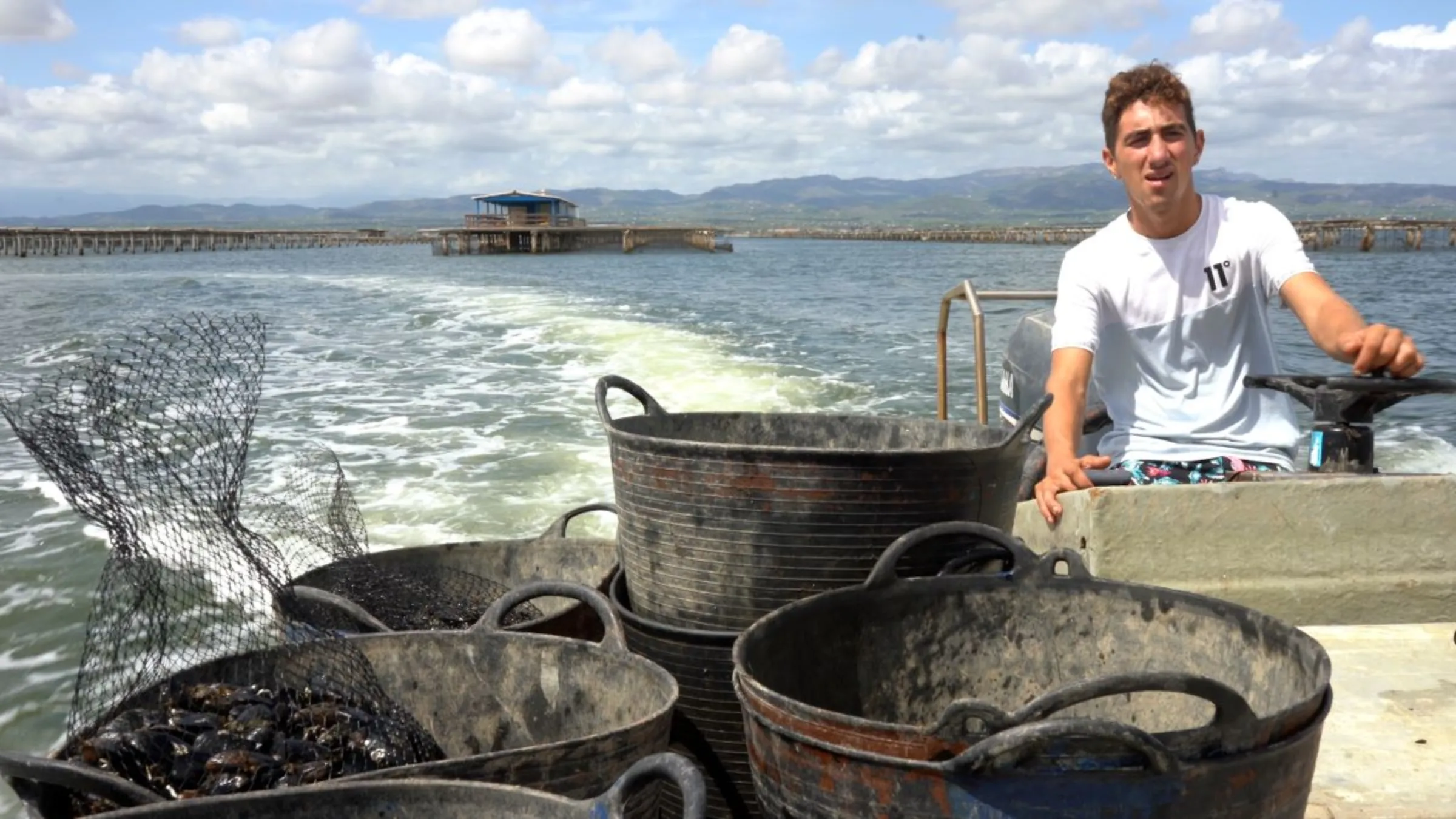 Xavier Cabrera’s son, Dídac, in Catalunya, Spain, September 1, 2023. Dídac studied aquaculture and wants to continue to work in the family business, but rising sea temperatures means the future is very uncertain. Thomson Reuters Foundation/Naomi Mihara