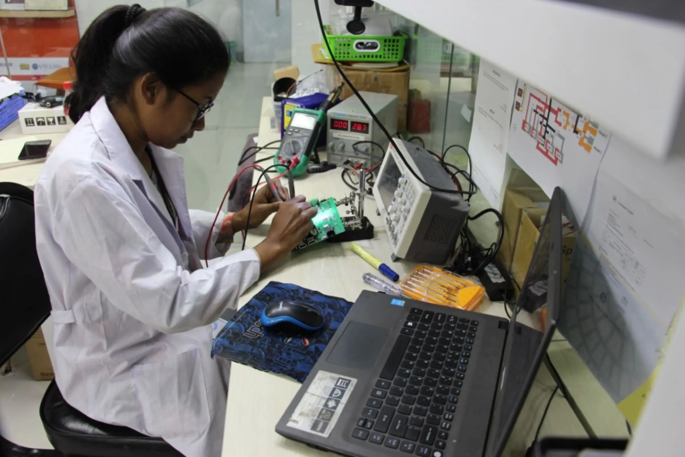 Farzana Akter Isha, a 24-year old engineer championing women's participation in Bangladesh energy transition, works at her desk in SOLshare, Dhaka, Bangladesh, January 2024. Farzana Akter Isha/Handout via Thomson Reuters Foundation