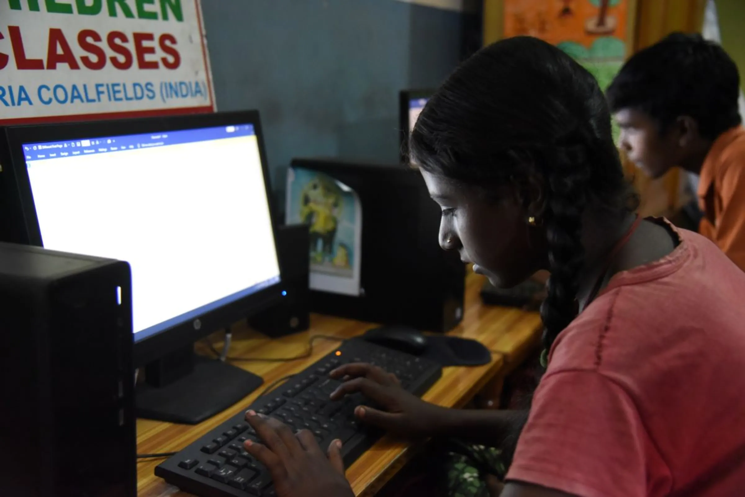 A child learns how to work on the computer at a class run by a non-profit that aims to give children an alternate career in the mining hub of Jharia, India, November 11, 2022. Thomson Reuters Foundation/Tanmoy Bhaduri