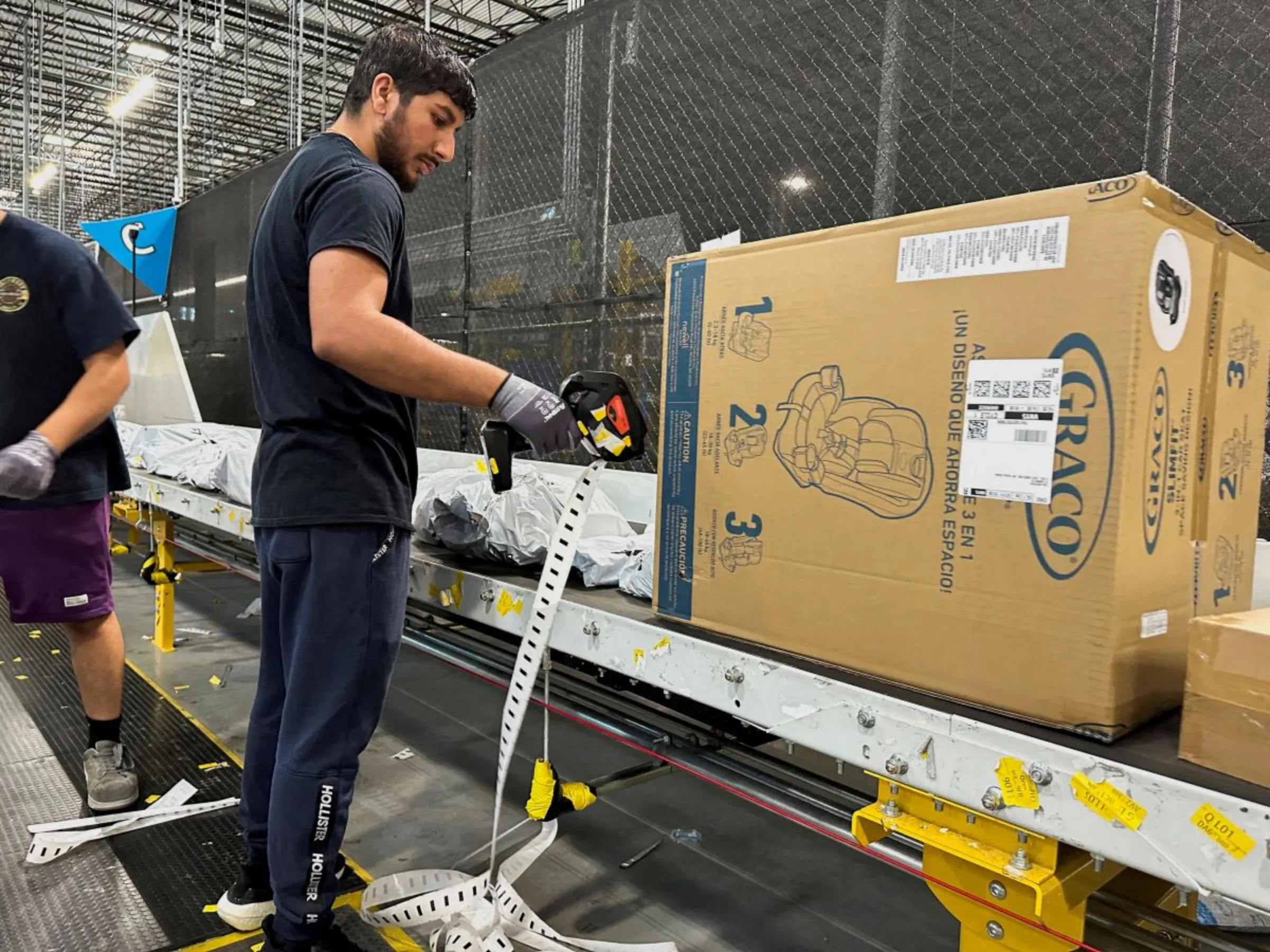 A person works at the Amazon warehouse, busy on Prime Day, in Melville, New York, U.S., July 11, 2023. REUTERS/Soren Larson