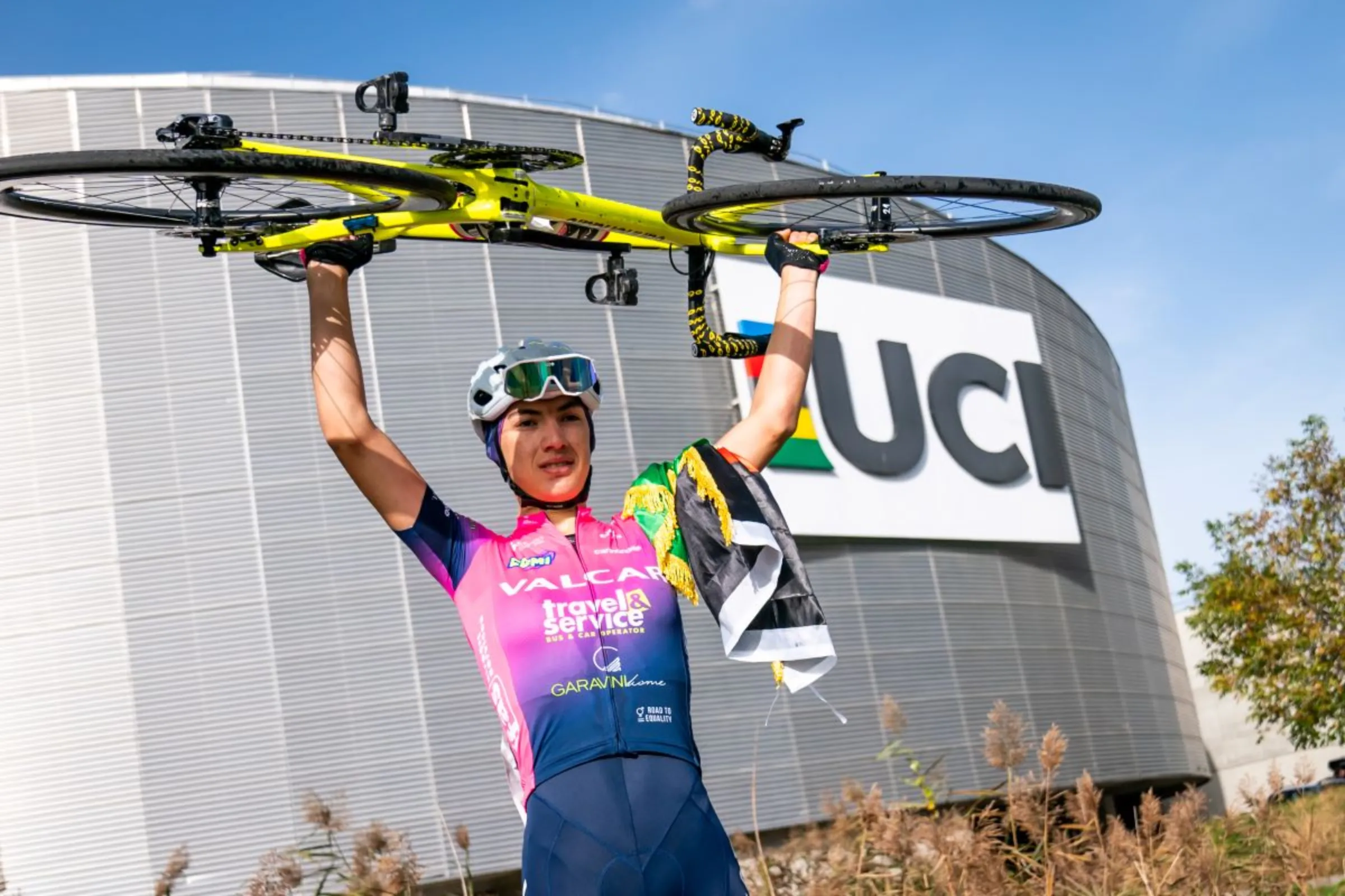 Fariba Hashmi celebrates after winning the Women's Road Championships of Afghanistan in Aigle, Switzerland in October 2022. Union Cycliste Internationale (UCI)/Handout via Thomson Reuters Foundation