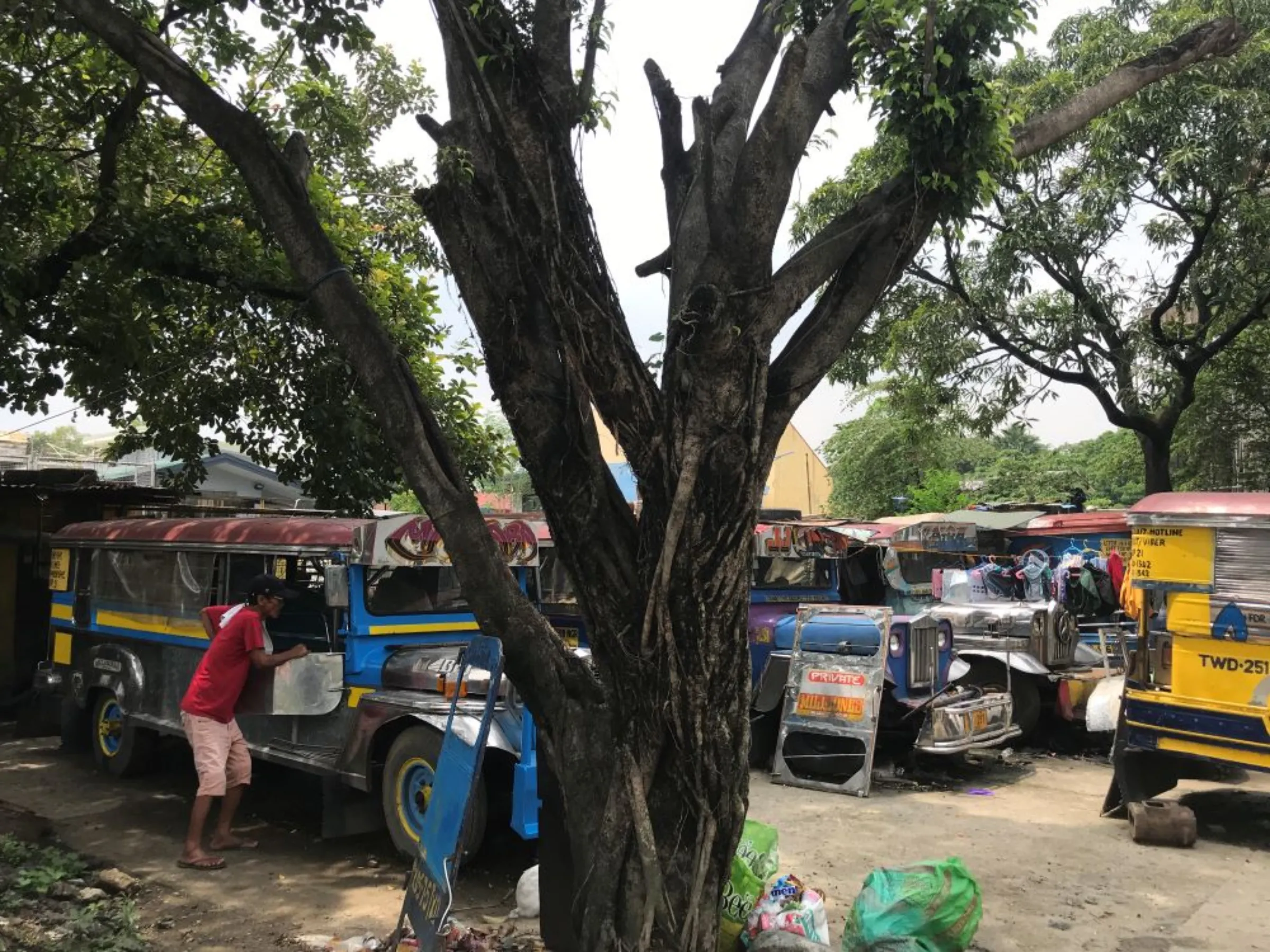 In this traditional jeepney garage in Marikina City, drivers who were forced off the road due to COVID-19 restrictions also use their units as temporary homes. September 16, 2022