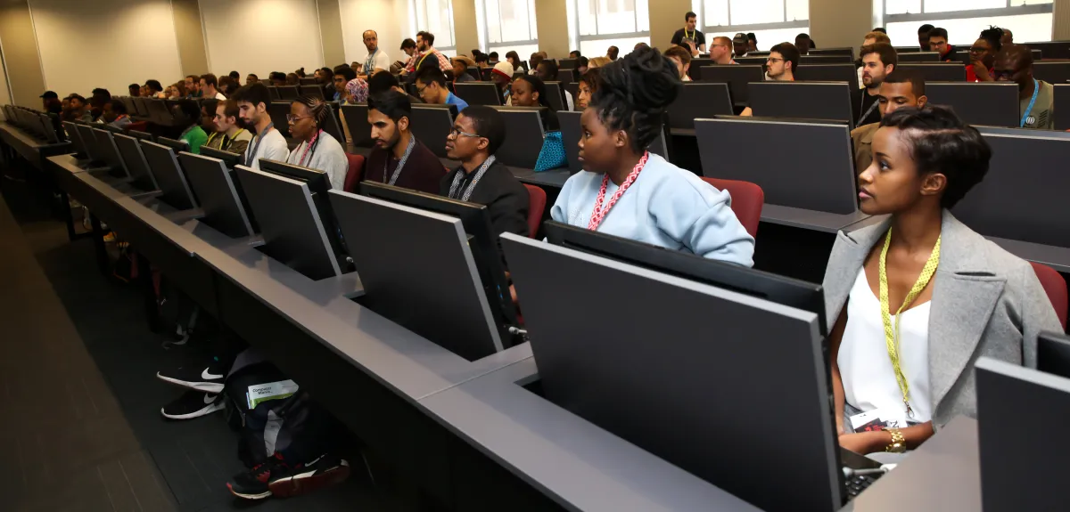 Attendees of the Deep Learning Indaba sit in front of computers during a lab practical at Stellenbosch University, South Africa.