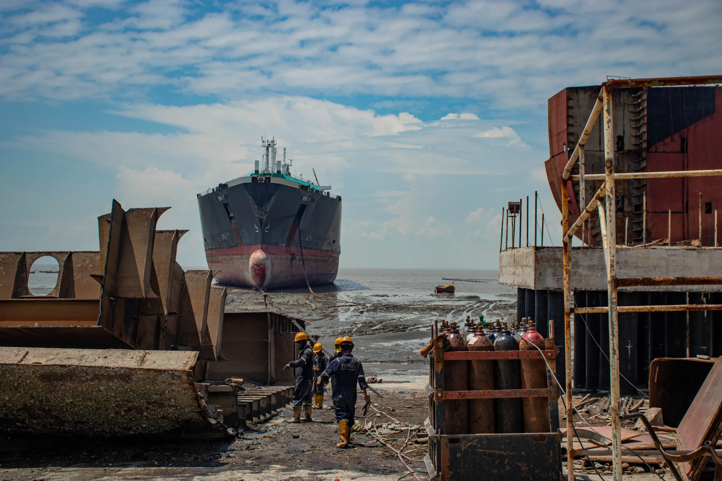 Workers on the impermeable floor at the PHP Shipbreaking Yard in Chattogram, Bangladesh on September 23, 2021