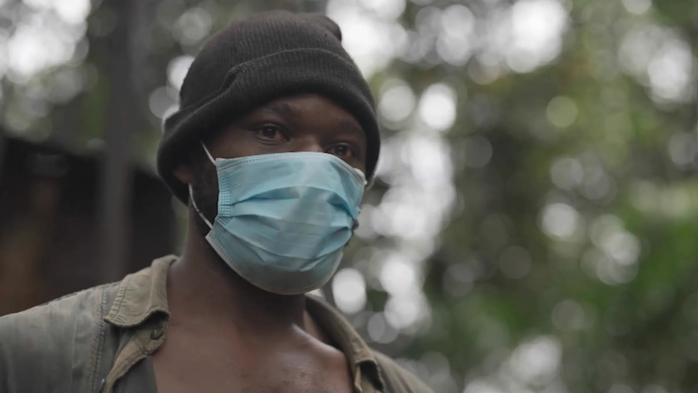 A man in a mask poses for a photo. Thomson Reuters Foundation