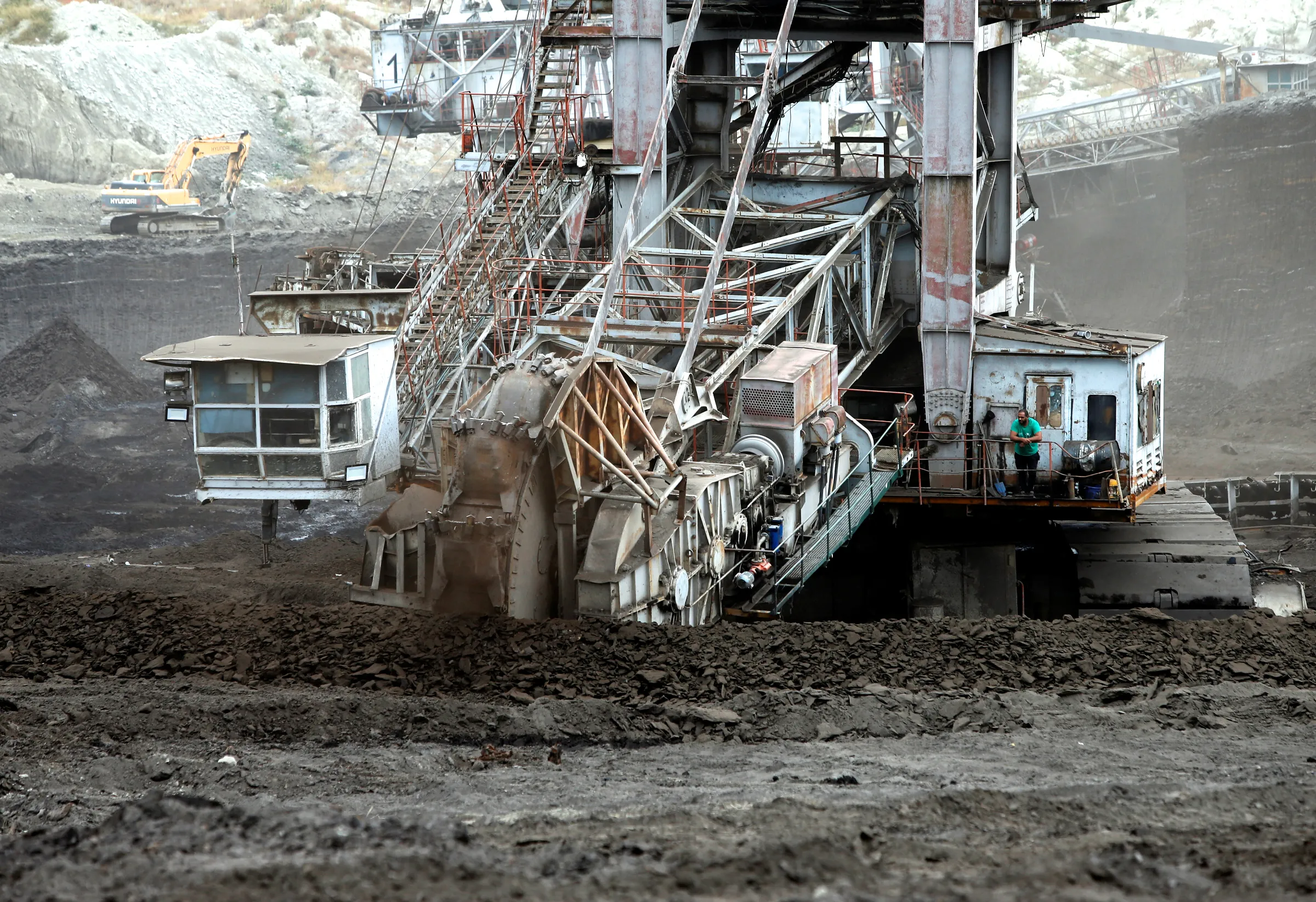 A worker looks from an excavator digging coal near the largest domestic electricity production facility REK Bitola, in Bitola, North Macedonia October 12, 2022. REUTERS/Ognen Teofilovski