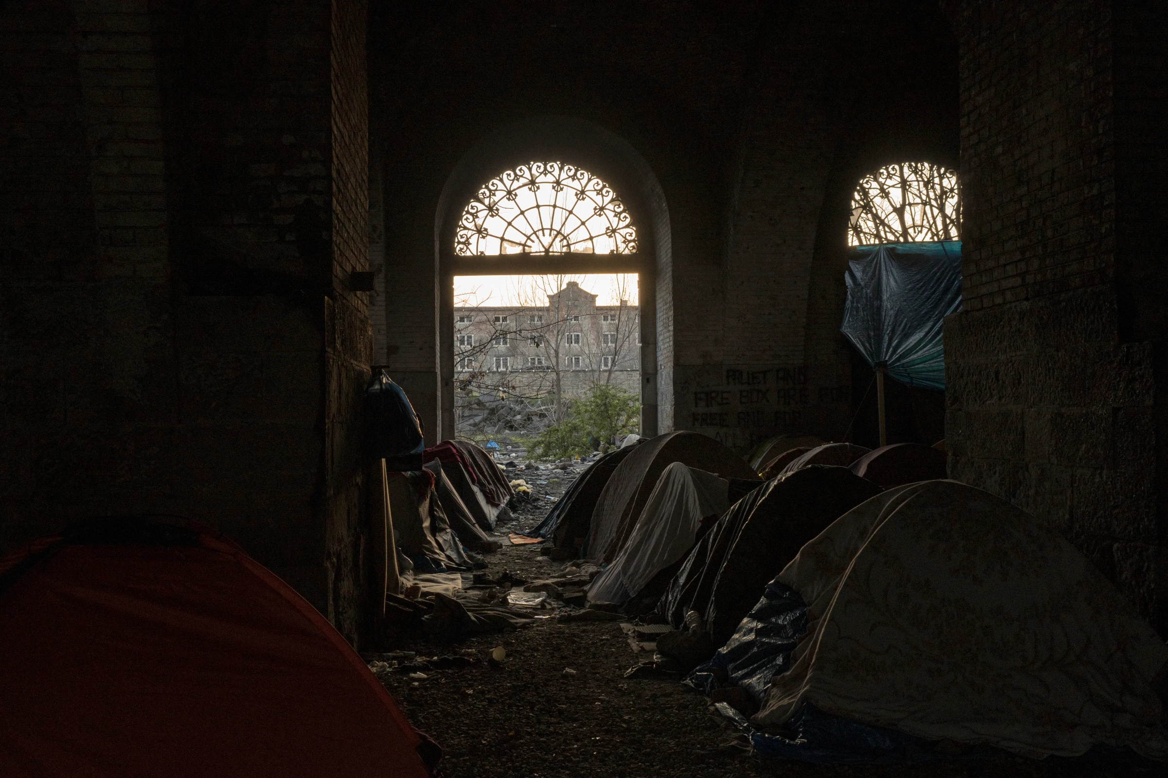 People on the move camp out in abandoned silos, in Trieste, Italy. March 5, 2024. Francesco Pistilli/International Rescue Committee/Handout via Thomson Reuters Foundation