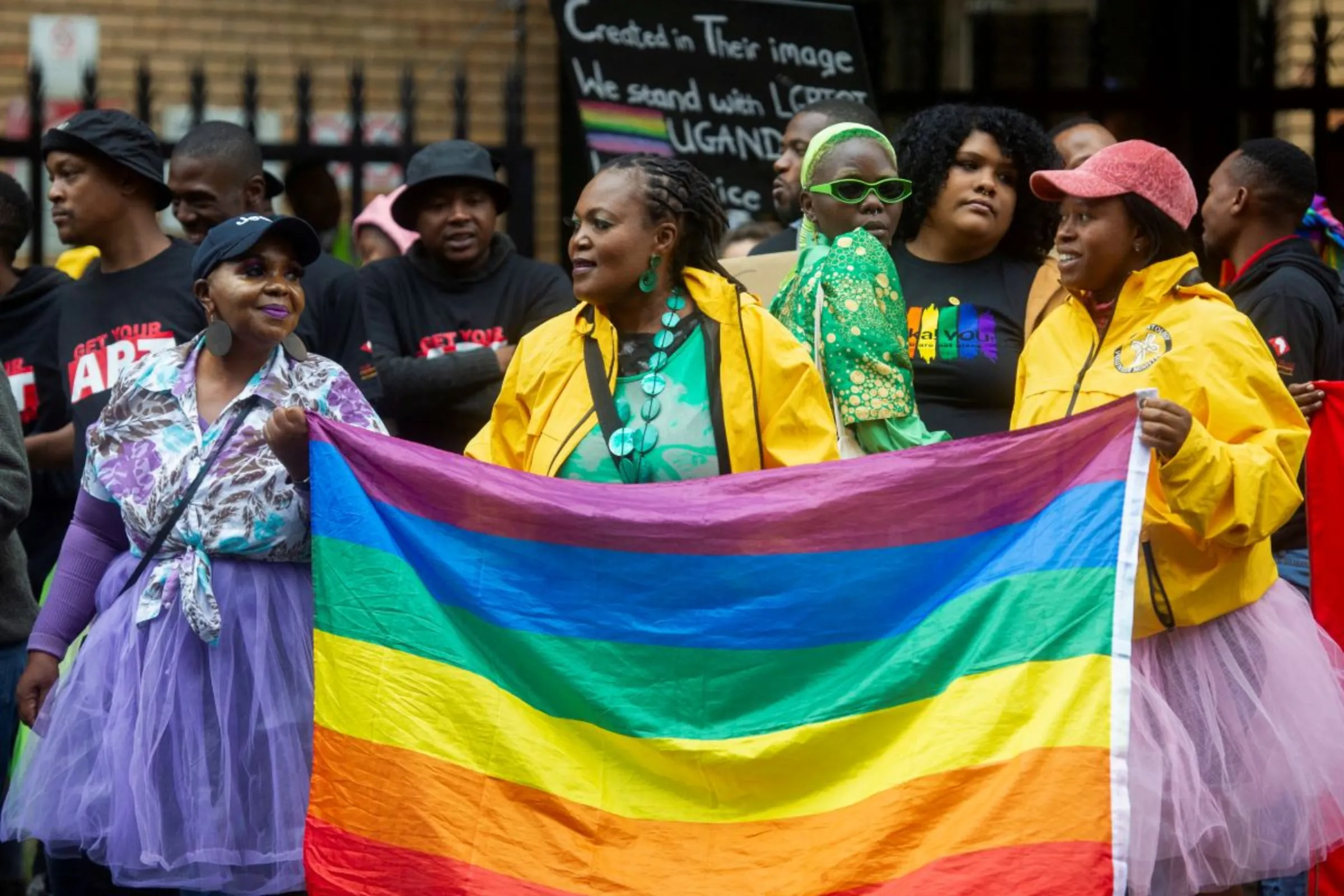 People hold placards during a demonstration against Ugandan anti-gay legislation  in Pretoria, South Africa on March 31, 2023 REUTERS/Alet Pretorius