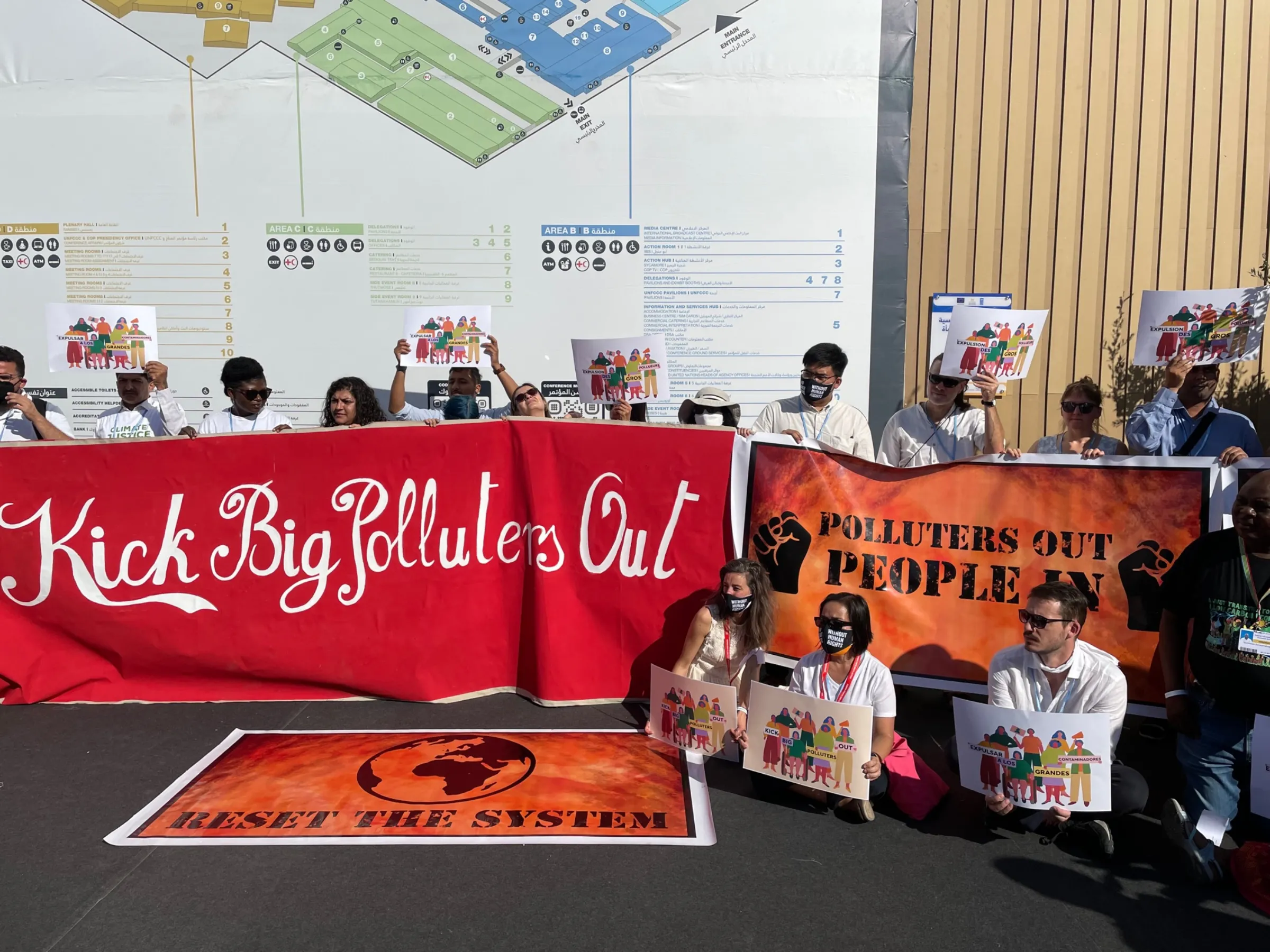 Climate activists demonstrate at the COP27 climate summit in Egypt against the presence of fossil-fuel industry representatives at the talks, Sharm El-Sheikh, Egypt, November 10, 2022. Thomson Reuters Foundation/Megan Rowling