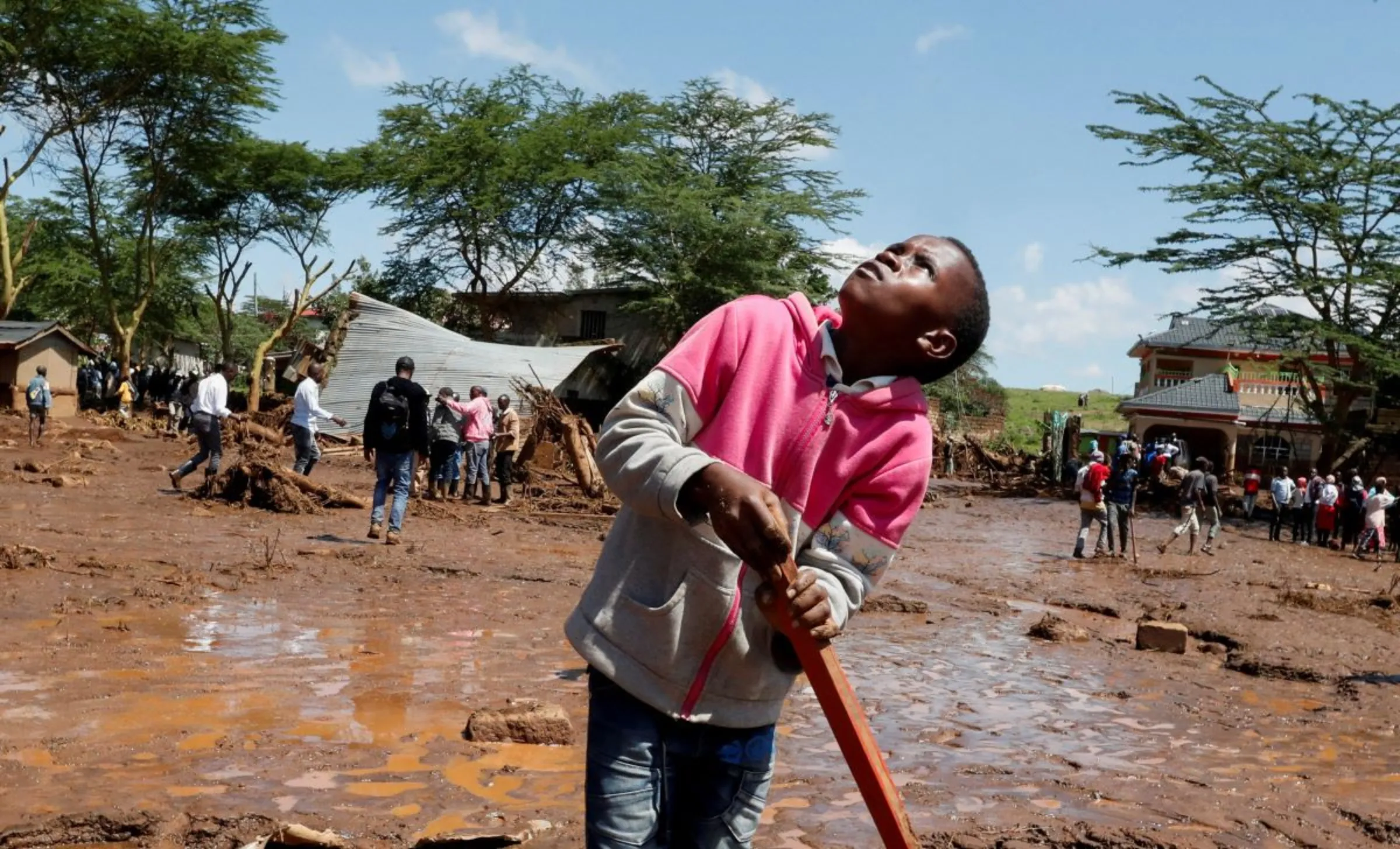 A boy looks at a helicopter after heavy flash floods in Kamuchiri village of Mai Mahiu, Nakuru County, Kenya April 29, 2024. REUTERS/Thomas Mukoya