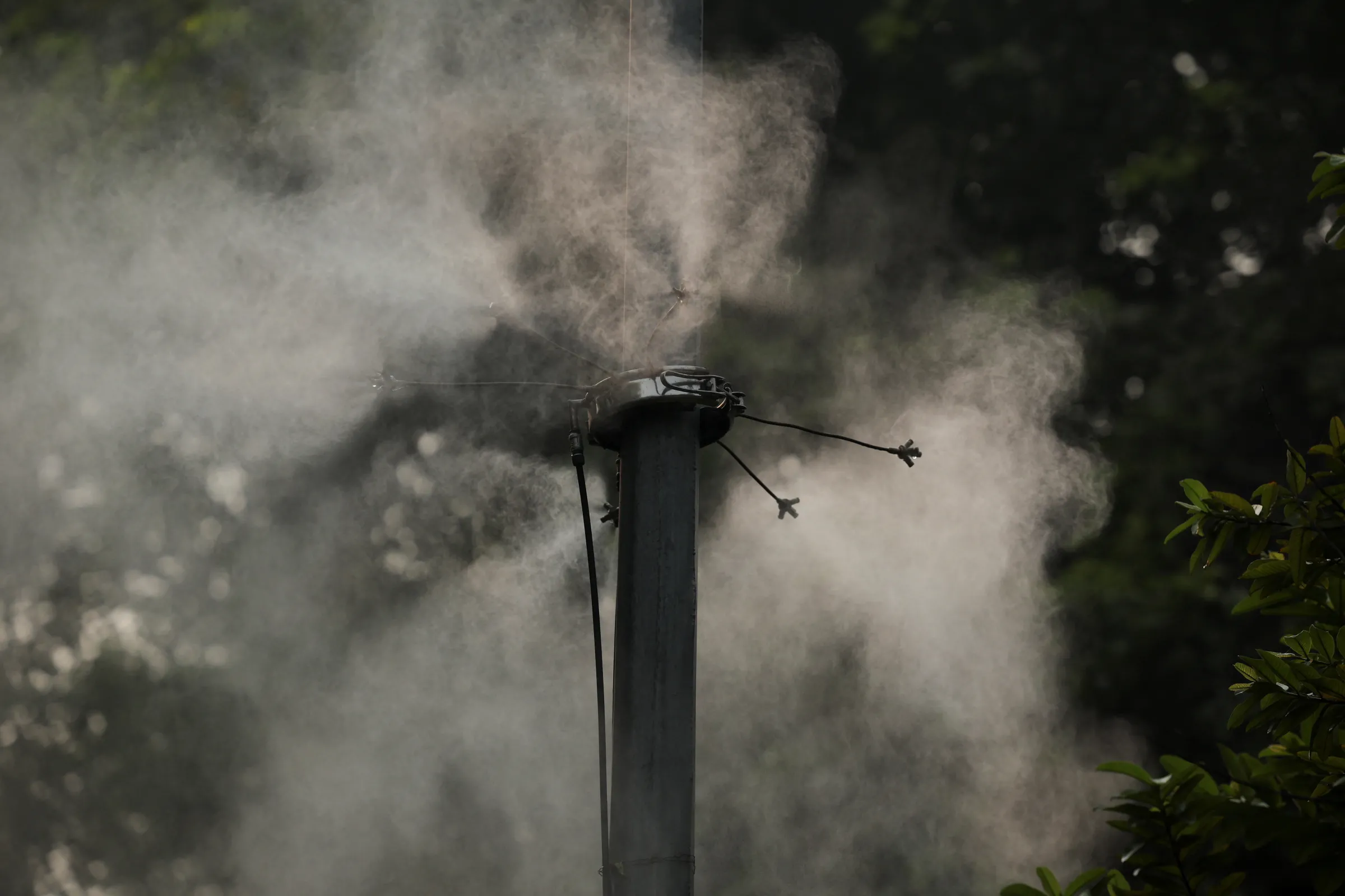 An anti-smog misting system installed on a road operates on a smoggy morning after air quality dips, partly due to the use of firecrackers during the Diwali festival in New Delhi, India, October 22, 2025. REUTERS/Anushree Fadnavis