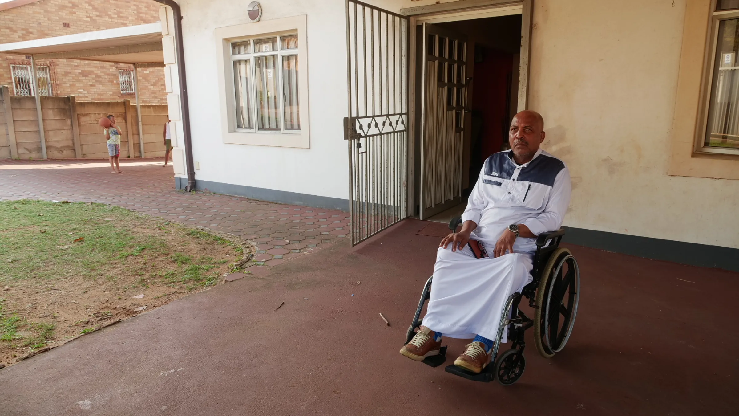 Abey Canthitoo, a member of the Makua community, poses for a photo outside his home in Bluff in Durban, South Africa