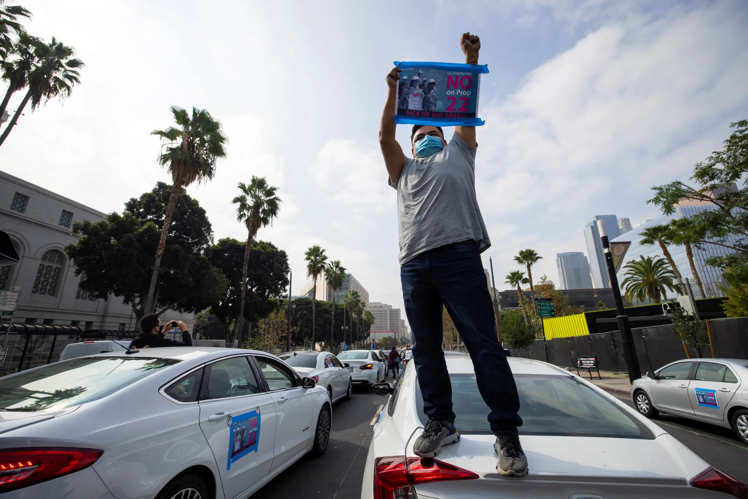 App-based gig workers hold demonstration outside Los Angeles City Hall to urge voters to vote no on Proposition 22 in California