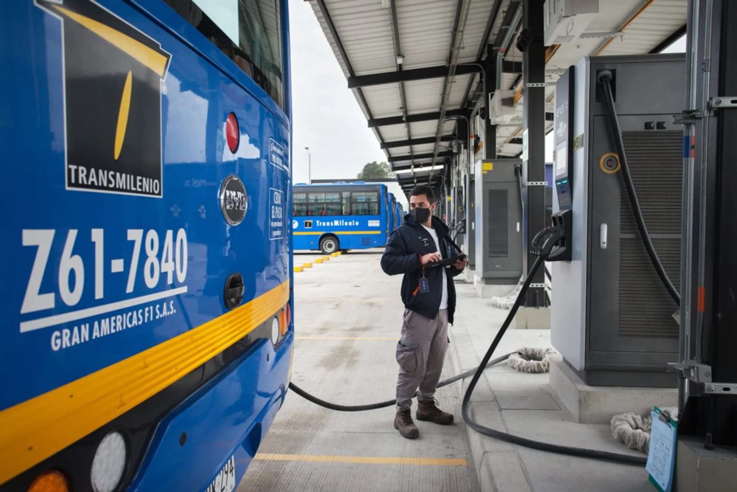 A technician checks an electric bus at a new charging depot built near the airport in Bogota, Colombia, April 21, 2021
