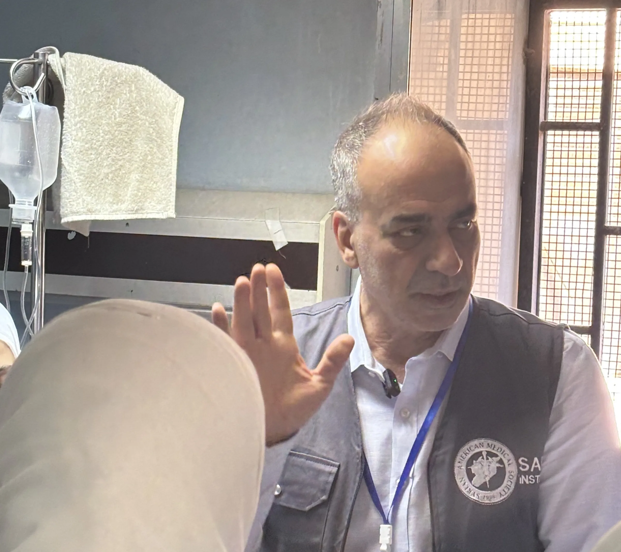 Gastroenterologist Dr. Bashar Hamad lectures students during patient rounds at the Al Mojtahed public hospital in Damascus. Damascus, Syria, May 21, 2025. Thomson Reuters Foundation/Nazih Osseiran