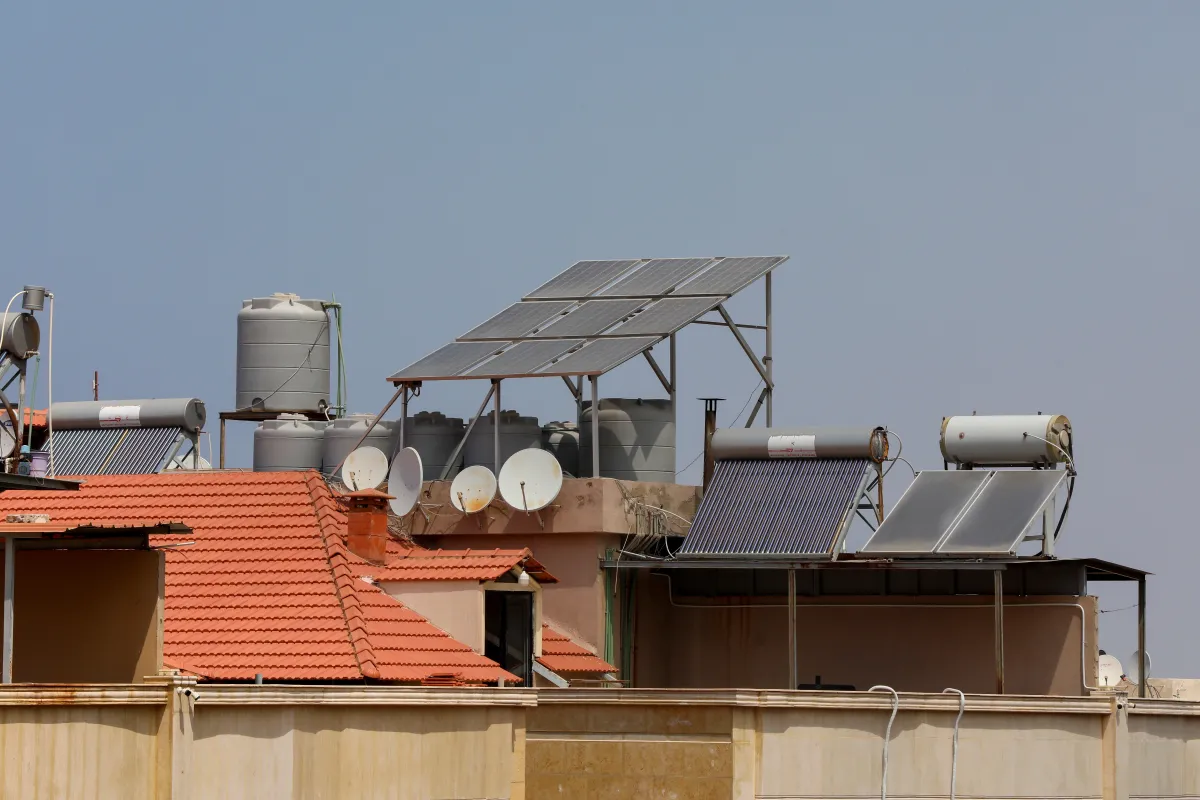 A solar panel installation is pictured on top of a building in Khaldeh, Lebanon August 25, 2021. Picture taken August 25, 2021