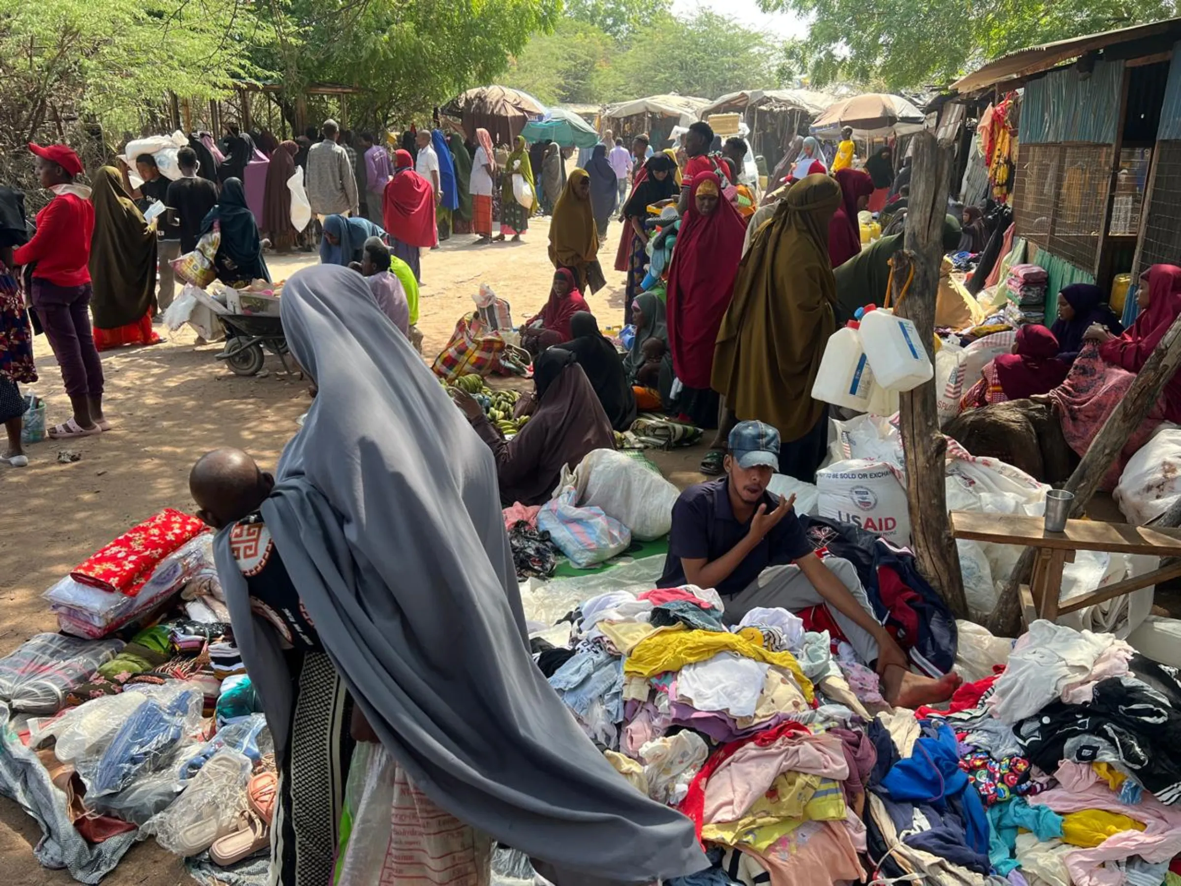Refugees from Somalia at a local market in Dadaab refugee camp in Garissa county, Kenya. Thomson Reuters Foundation/Abdirizak Mohamed Sheikh