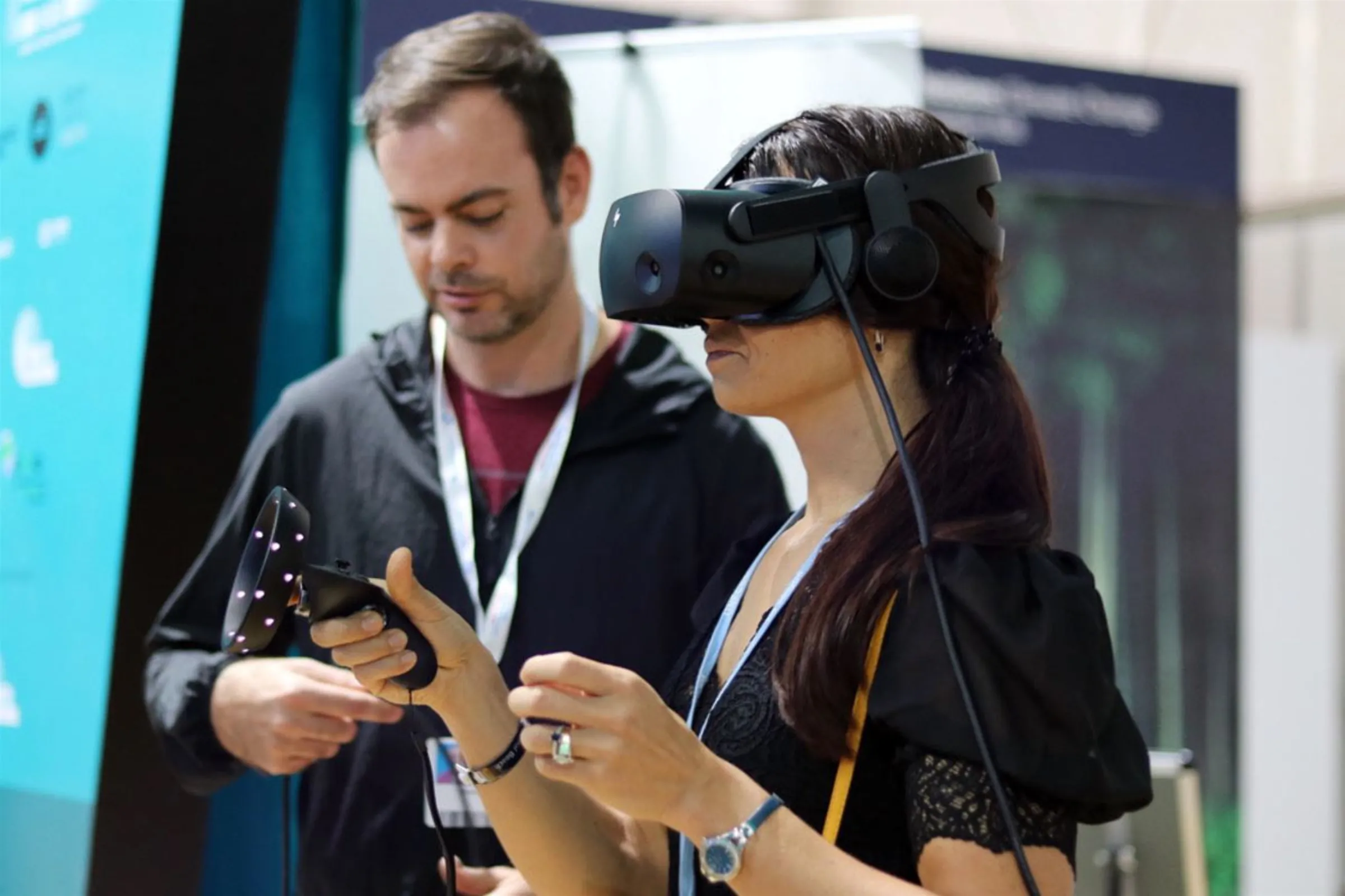 Chance Glasco, the producer of an Adrienne Arsht–Rockefeller Foundation Resilience Center virtual reality video game, shows it to a user at the COP27 U.N. climate talks in in Sharm el-Sheikh, November 2022. Adrienne Arsht–Rockefeller Foundation Resilience Center/Handout via Thomson Reuters Foundation