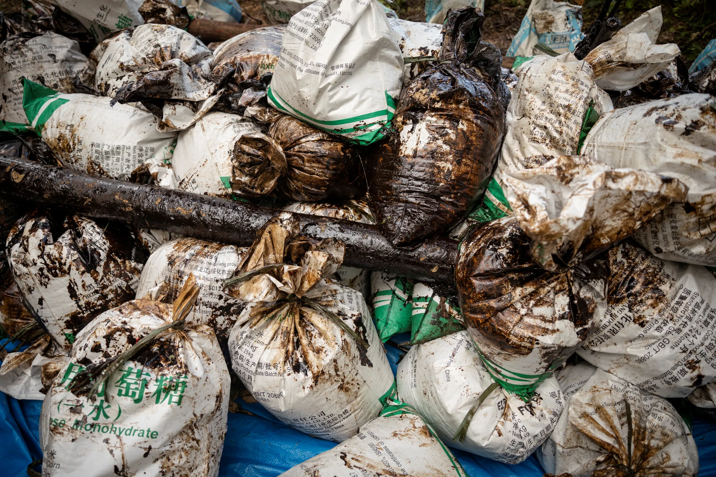 Sacks of waste gathered from the oil spill are placed on the shore of Pola in Oriental Mindoro province, Philippines, March 7, 2023. REUTERS/Eloisa Lopez