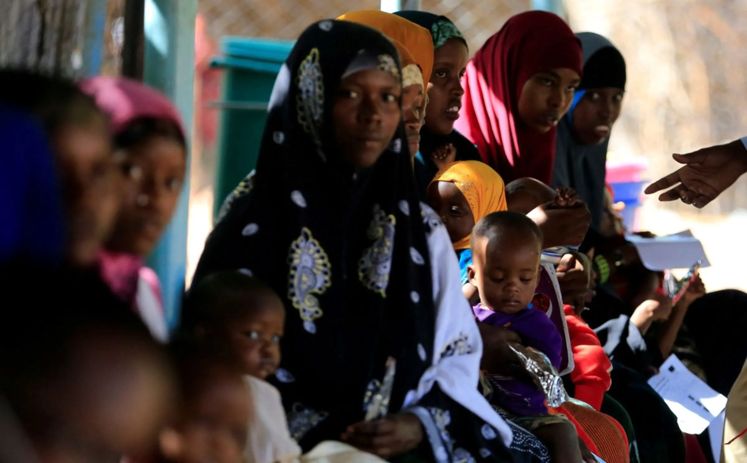 Somali refugee women carry their malnourished children at the International Rescue Committee (IRC) health post in the Hagadera refugee camp in Dadaab, near the Kenya-Somalia border, in Garissa County, Kenya, January 17, 2023